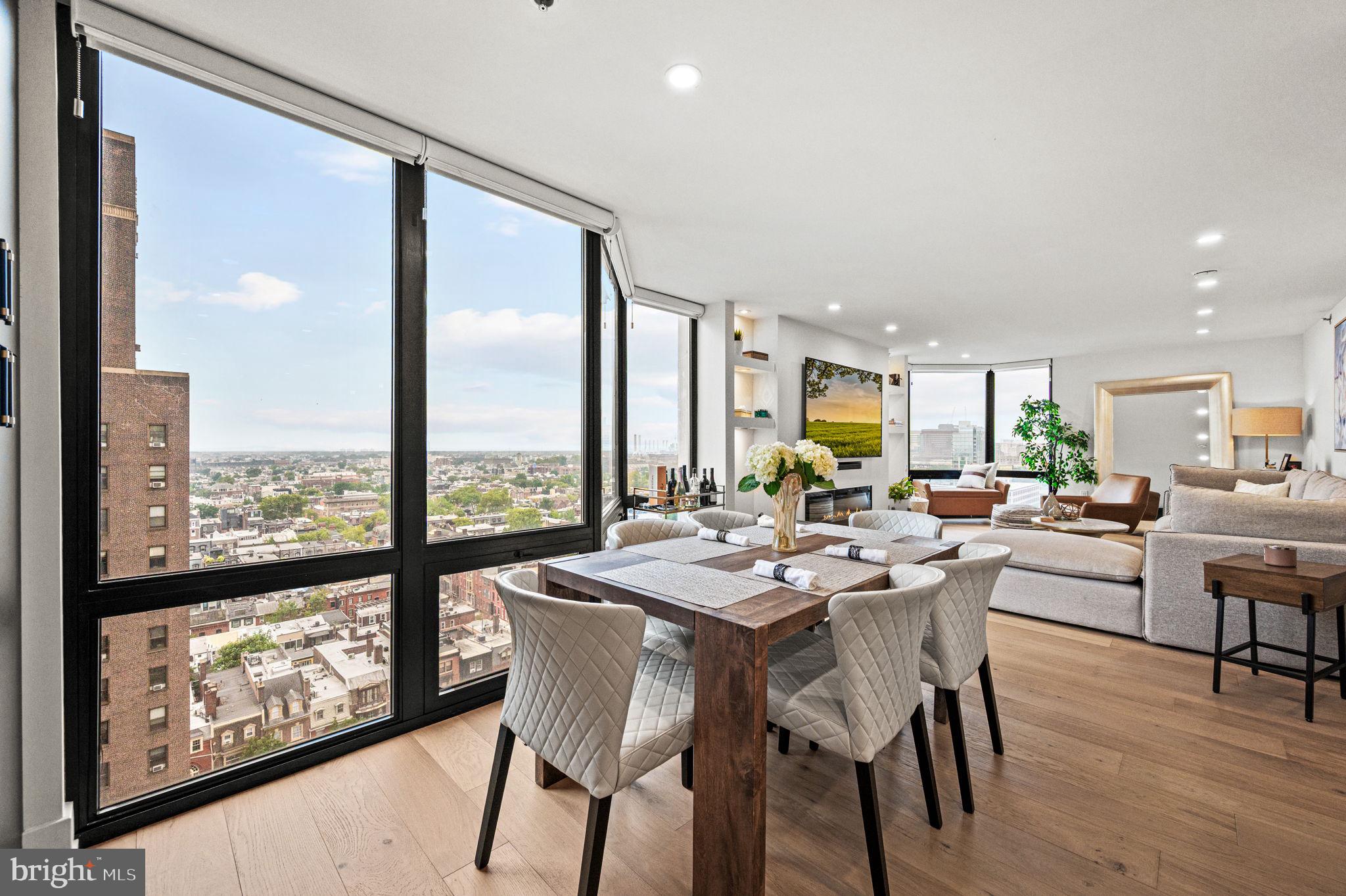 Elevated style and modern comfort define this brand new renovation in the desirable Wanamaker House, ideally positioned in the heart of Rittenhouse Square. This sophisticated 3 bedroom, 3 bath residence boasts unobstructed southwest views, flooding the home with natural light and offering unforgettable sunsets. The custom-designed chef’s kitchen is both beautiful and functional, featuring Bosch, GE Profile, Sharp, and Fisher & Paykel appliances, including a panel-ready Bosch refrigerator, induction cooktop, wine fridge, and vented hood. Quartz countertops with a dramatic waterfall edge, a matching backsplash, custom cabinetry, and a built-in pantry complete the space. Wide-plank white oak engineered flooring flows throughout the home, paired with recessed LED lighting for a clean, contemporary look. The spacious living area includes a sleek electric fireplace, built-in TV walls, and custom battery-operated window treatments for effortless style and comfort. Each bathroom is elegantly finished in porcelain tile with Blossom vanities, LED mirrors, and premium fixtures. The spa-inspired primary bath features a custom double sink vanity, a walk in shower with dual shower heads, a handheld spray, and a built-in bench. The primary suite offers exceptional storage with two custom walk-in closets, a linen closet, and an additional storage closet, plus a laundry closet with a full-size Whirlpool washer and ventless dryer.
Residents of The Wanamaker House enjoy a modern lobby and hallways, 24-hour door staff, a fitness center with sauna, reading lounge, entertaining space with a catering kitchen, and a seasonal rooftop pool with panoramic city views. The building is cat-friendly, and garage parking is available for rent subject to availability. Perfectly located, the Wanamaker House offers easy access to 30th Street Station, Penn, Drexel, the Wharton School, Schuylkill River Trail, and is just minutes from Rittenhouse Square’s renowned dining including Vernick, My Loup, Little Water, and Friday, Saturday, Sunday.