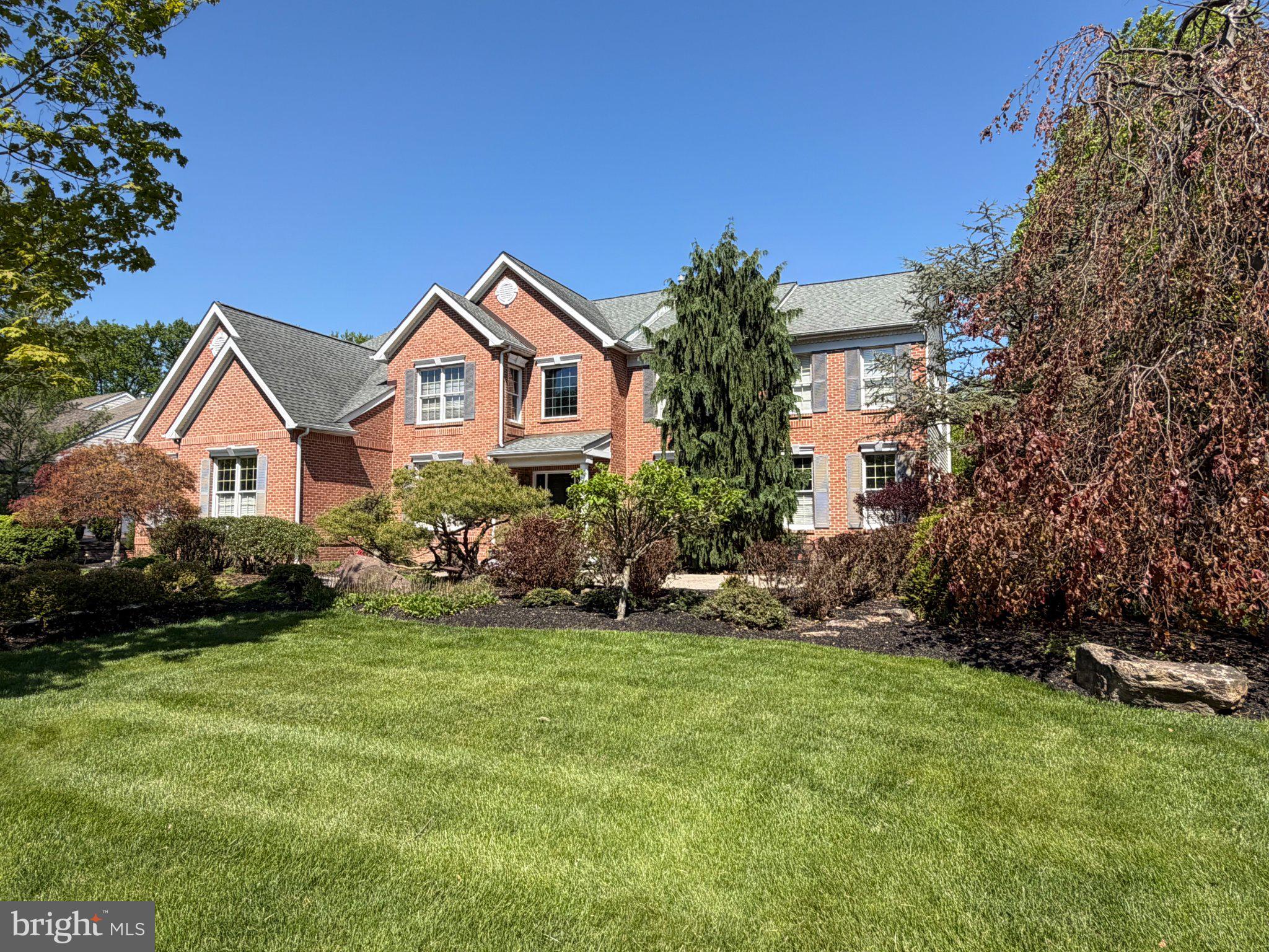 Gorgeous estate like home with expansive back yard views, a Grand Two Story Entry and a Beautiful Two Story Family Room! Very Spacious Family Room with a stunning Two Story Stone wood burning fireplace! Ample natural lighting with plentiful windows throughout! This gem is in the coveted Oaks of Buckingham, situated in the heart of historic Central Bucks County. On previous farmland property, a truly Beautiful Wooded Setting and property that backs to mature trees framing glowing sunsets, now available for the first time by original owners. The well-maintained beautiful property has views of surrounding nature out of every room, boasting a serene getaway, while still being minutes from Doylestown Boro, Peddlers Village in Lahaska and driving distance to Philadelphia, New Hope, Lambertville NJ and NYC. Walk and biking paths accessible to two-39-and-49-acre Buckingham Township parks. Thoughtful landscape lines entrance paver brick walkway and paver patio. Enter the front door and you are invited into the home's Grand Two Story Foyer with hardwood floors and beautiful staircase. The formal living room opens seamlessly into the dining room, with double French doors connecting the ample, quiet conservatory, providing great entertaining space for guests. The private office off the entrance foyer is ideal for remote work. There is a 3-Car Garage entering near the laundry/mudroom. Enjoy the bright sunroom right off of the kitchen with skylights overlooking the gorgeous back yard with wooded views. The expansive chef style kitchen, with custom tiled flooring, is equipped with two ovens, gas range and a large island, expanding into the breakfast room, delivering tree-lined views from the airy skylit sunroom. This focal point of the home spans into the Grand Two-Story Family Room, showcasing the floor-to-ceiling fireplace, constructed with local Bucks County stone and a wall of two-story windows overlooking towering trees. Both the foyer and rear full staircases lead up towards the Primary Bedroom Suite with Sitting Room and Tray Ceiling. The primary has a large bathroom with Cathedral Ceiling, Italian Tile soaking tub and vanity. There is also a 16-foot expansive walk-in closet. Adjacent to the primary suite is the luminous second story foyer, that separates the primary from the four additional ensuite bedrooms, each of comfortable size with ample closet space. The large, finished basement has built in shelving, an exercise room, a play/media area and separate storage, giving you additional space for all your needs. This well thought out home already has natural gas line already installed for a future gas fireplace in the master. The sunny backyard is great for sports to be played and backs to a beautiful wooded scenic area. Relax in the Fourteen Foot Octagonal Gazebo under the shade of the tall forest of trees. The extensive backyard is a gorgeous setting with potential for a pool, deck, patio or expanded outdoor living space. Fenced yard with extra-large entrance of two five-foot aluminum gates. Generous room sizes and closets throughout along with ample windows (Anderson) for natural lighting. The included Kitchen Refrigerator is a top-of-the-line Cafe model, Quad Door with Chiller/Frig/Freezer option, purchased September 2022. The included LG Large Capacity washer and Large Capacity Steam capable dryer (used mostly just for 2 people). The Bosch three tier dishwasher, extra quiet, was purchased in 2018 (mostly used for 2 people). All 5 Bedrooms have direct access to a bathroom which is a rare amenity and a real convenience for family and or guests! Jack & Jill Bathroom updated 1/2020. Large basement with Game-room, Play-room, Exercise room and Entertainment Room. A must-see Beautiful Property and setting! This wonderful Doylestown home in scenic Central Bucks County awaits! Hurry! Schedule your appointment before it's too late!