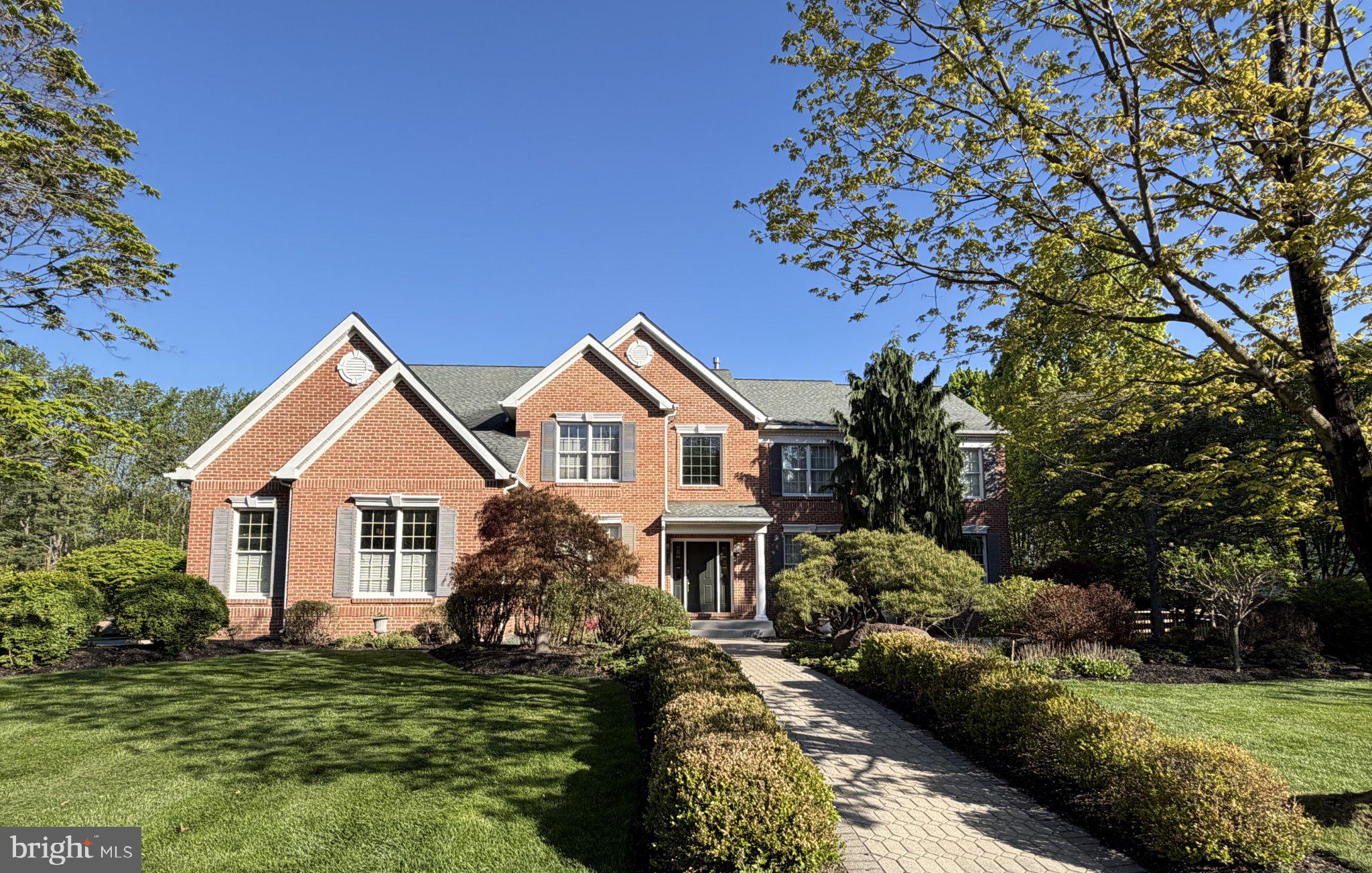 Gorgeous estate like home with expansive back yard views, a Grand Two Story Entry and a Beautiful Two Story Family Room! The very spacious Family Room has a stunning Two Story Stone wood burning fireplace and ample natural lighting with plentiful windows! This gem is in the coveted Oaks of Buckingham, situated in the heart of historic Central Bucks County. On previous farmland property, a truly Beautiful Wooded Setting and property that backs to mature trees framing glowing sunsets, now available for the first time by original owners. The well-maintained beautiful property has views of surrounding nature out of every room, boasting a serene getaway, while still being minutes from Doylestown Boro, Peddlers Village in Lahaska and driving distance to Philadelphia, New Hope, Lambertville NJ and NYC. Walk and biking paths accessible to two-39-and-49-acre Buckingham Township parks. Thoughtful landscape lines entrance paver brick walkway and paver patio. Enter the front door and you are invited into the home's Grand Two Story Foyer with hardwood floors and beautiful staircase. The formal living room opens seamlessly into the dining room, with double French doors connecting the ample, quiet conservatory, providing great entertaining space for guests. The private office off the entrance foyer is ideal for remote work. There is a 3-Car Garage entering near the laundry/mudroom. Enjoy the bright sunroom right off of the kitchen with skylights overlooking the gorgeous back yard with wooded views. The expansive chef style kitchen, with custom tiled flooring, is equipped with two ovens, gas range and a large island, expanding into the breakfast room, delivering tree-lined views from the airy skylit sunroom. This focal point of the home spans into the Grand Two-Story Family Room, showcasing the floor-to-ceiling fireplace, constructed with local Bucks County stone and a wall of two-story windows overlooking towering trees. Both the foyer and rear full staircases lead up towards the Primary Bedroom Suite with Sitting Room and Tray Ceiling. The primary has a large bathroom with Cathedral Ceiling, Italian Tile soaking tub and vanity. There is also a 16-foot expansive walk-in closet. Adjacent to the primary suite is the luminous second story foyer, that separates the primary from the four additional ensuite bedrooms, each of comfortable size with ample closet space. The large, finished basement has built in shelving, an exercise room, a play/media area and separate storage, giving you additional space for all your needs. This well thought out home already has natural gas line already installed for a future gas fireplace in the master. The sunny backyard is great for sports to be played and backs to a beautiful wooded scenic area. Relax in the Fourteen Foot Octagonal Gazebo under the shade of the tall forest of trees. The extensive backyard is a gorgeous setting with potential for a pool, deck, patio or expanded outdoor living space. Fenced yard with extra-large entrance of two five-foot aluminum gates. Generous room sizes and closets throughout along with ample windows (Anderson) for natural lighting. The included Kitchen Refrigerator is a top-of-the-line Cafe model, Quad Door with Chiller/Frig/Freezer option, purchased September 2022. The Kitchen-Aid cook-top stove was purchased March 2023. The included LG Large Capacity washer and Large Capacity Steam capable dryer (used mostly just for 2 people). The Bosch three tier dishwasher, extra quiet, was purchased in 2018 (mostly used for 2 people). All 5 Bedrooms have direct access to a bathroom which is a rare amenity and a real convenience for family and or guests! Large basement with Game-room, Play-room, Exercise room and Music Room. A must-see Beautiful Property and setting! This wonderful Doylestown home in scenic Central Bucks County awaits! Hurry! Schedule your appointment before it's too late!