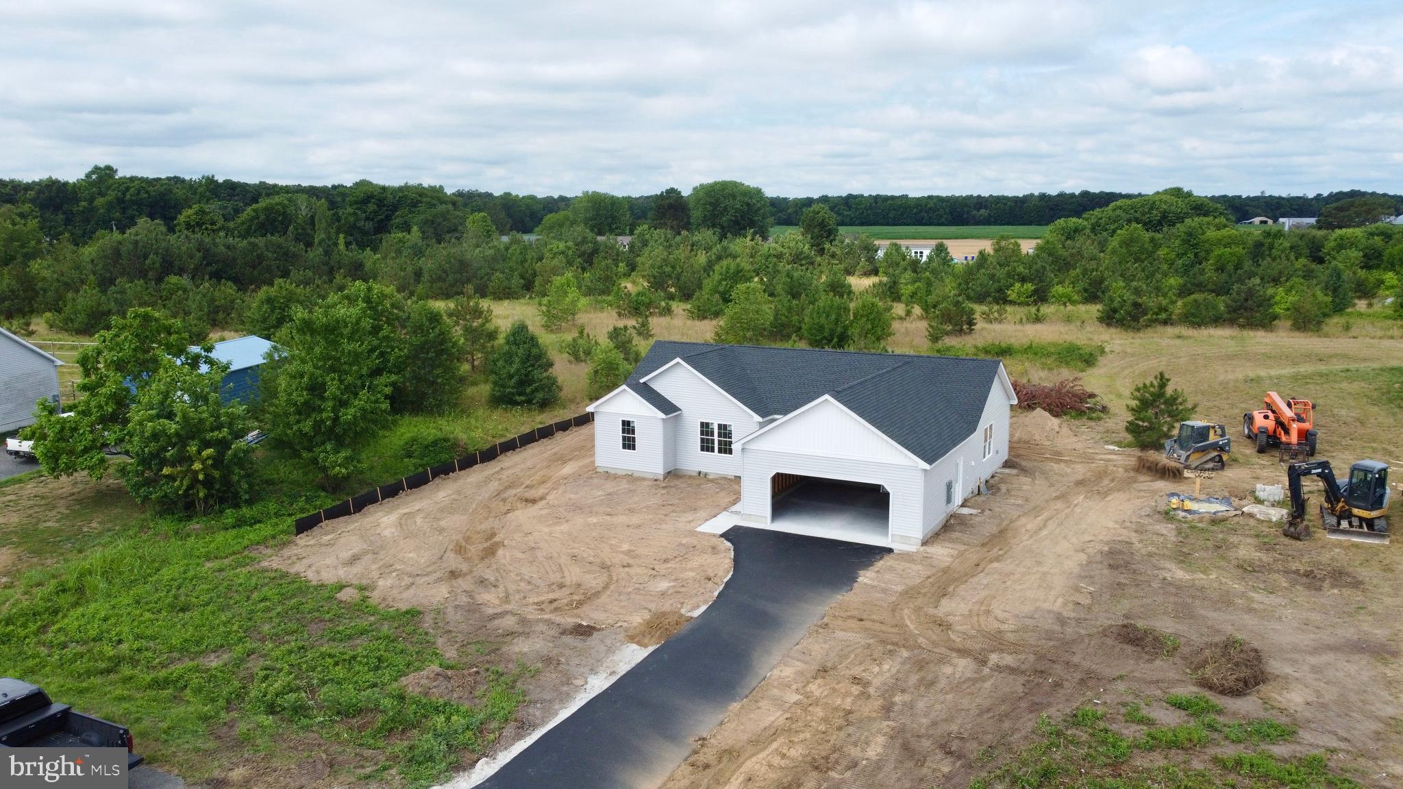 Welcome to the Portsmith Model, a beautifully crafted new-construction home situated on a spacious .66 acre lot with exceptional privacy and peaceful farmland views. Built by a respected local builder, this home offers quality craftsmanship, thoughtful design, and attention to detail throughout.

The open-concept floor plan seamlessly connects the kitchen, dining area, and great room, creating a bright and inviting space ideal for everyday living and entertaining. The well-designed kitchen serves as the heart of the home, offering an effortless setting for hosting family and friends. Durable luxury vinyl plank flooring provides a stylish, low-maintenance finish designed for modern living.

Enjoy added peace of mind with a builder-backed warranty and the convenience of a brand-new home without the typical construction wait. Located on a truly special homesite surrounded by scenic farmland, this property offers the perfect combination of privacy, comfort, and beautiful rural views.

Construction is nearing completion, with the home expected to be fully finished and move-in ready in under 60 days. Don’t miss this opportunity to make a brand-new home your own!