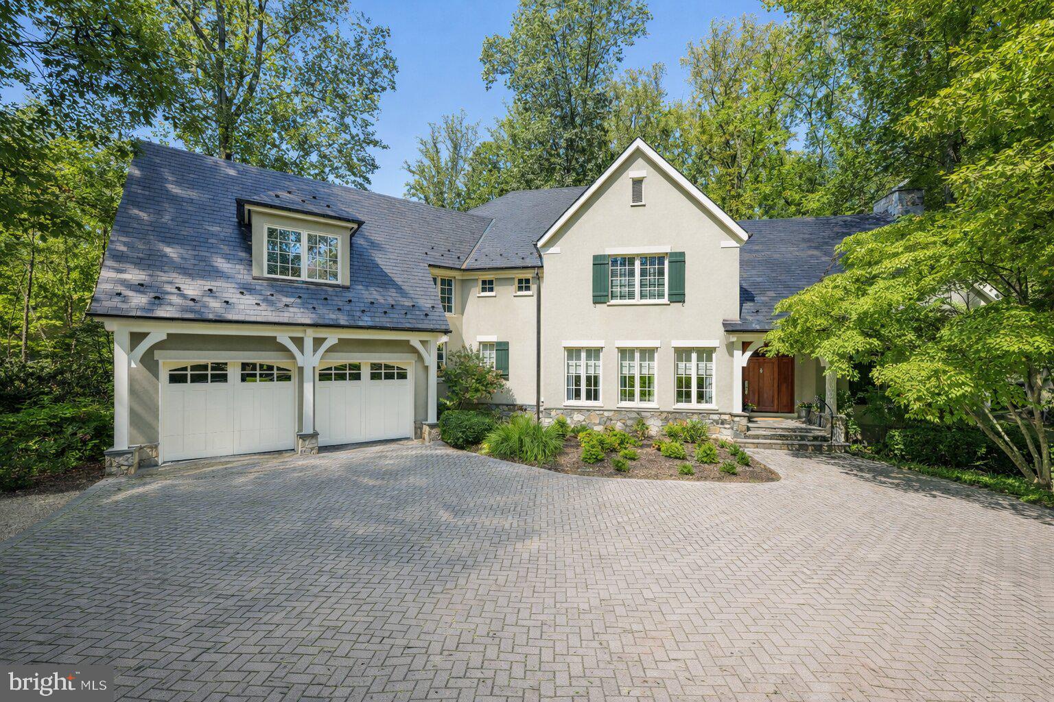 Prepare to be enchanted from the moment you arrive...how do you begin to describe the exceptional construction quality of a home like this?  A  home that won the Maryland Building Industry- Award of Excellence- for custom construction.  The level of attention to detail is nearly impossible to capture in words-it simply has to be experienced to be believed.  And beyond the home itself, this beauty is nestled within the coveted community of Merry-Go-Round Farm - a setting defined by rolling fields, preserved natural landscapes, and a true sense of pastoral serenity.  A sense of community envelopes you with Fourth of July activities, a festive Hallowe'en celebration and so much more, cherished traditions bringing everyone together, creating bonds that make this neighborhood feel more like family than simply a place to live.  Here, horses graze in wide-open pastures, neighbors enjoy miles of trails , and the equestrian center continues the timeless charm of the Potomac hunt country.  From the handsome exterior stone and stucco finish to copper gutters and a slate roof, architectural beauty is on display at every turn.  The rear of the home is as attractive as the front! Inside, the show-stopping eat-in Gourmet Kitchen truly feels like the heart of the home.  A generous center island topped with beveled granite, high-end stainless steel appliances and abundant Decora cabinetry provide both elegance and function.  The field stone gas fireplace next to the eating area adds warmth and ambiance, while the private year round porch invites you to relax in a tranquil, tree-lined sanctuary.   The main level reflects a consistent focus on quality and comfort.  From the marble and wood inlay floors of the foyer, to the soaring two-story Family Room with a stunning floor-to-ceiling stone fireplace, every space is thoughtfully designed.  Front and back staircases, substantial crown and base moldings, a butler's pantry, and a spacious mudroom with a wall of built-ins further elevate your daily living.  Upstairs, the sumptuous Primary Suite is a true retreat.  With a vaulted ceiling, private reading room and a huge walk-in closet, it is both gracious and intimate.  Four generously proportioned bedrooms, each with its own en-suite bath, and a smartly designed laundry room complete the upper level.  Oh! Don't miss the outdoor deck where you can escape to the treetops. The daylight, walk-out Lower Level offers endless flexibility with a sprawling recreation room, an exercise room, a private bedroom/au pair suite with full bath plus additional bonus space to create a media room or wine cellar as you desire.  As throughout the rest of the home, the finishes are of the highest quality, with wonderful ceiling heights and an abundance of space.   The rear yard with a flagstone terrace and tall, towering trees backs to greenspace and, unlike many homes in Merry-Go-Round,  can accommodate an inground pool if that is on your wish list.   This residence is more than just a home - it's a statement of craftsmanship, livability and timeless design.  A property of this caliber, with such an uncompromising level of finish, simply cannot be recreated in today's market at this price.  Don't miss this rare opportunity to own a home that enchants, inspires, and elevates your everyday living - make it yours today!