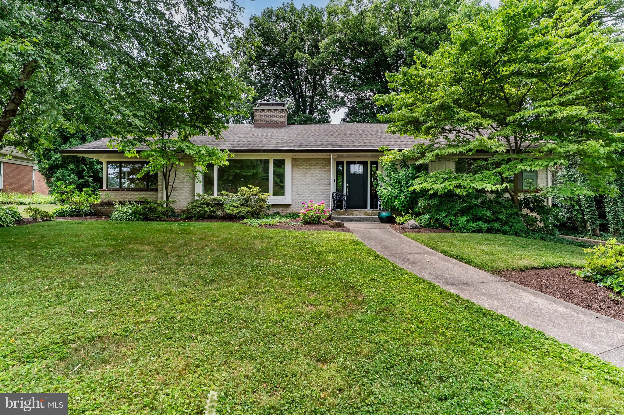 Welcome home to 450 N. 25th Street, a sprawling brick ranch home in the heart of Camp Hill Borough, just steps from Siebert Park and located within the highly desirable Camp Hill School District. Offering over 2,500 square feet of finished living space, this home combines spacious one-floor living with an exceptional location.  Hardwood floors flow throughout the main level, where you'll find a bright and inviting living room featuring a gas fireplace and oversized windows that fill the space with natural light. The adjoining dining area leads to a well-appointed kitchen with gas cooking and a separate breakfast room, perfect for everyday meals. A cozy den showcases rich wood-paneled walls, built-in shelving, and a second gas fireplace, creating the ideal space for relaxing or working from home.  The sun room overlooks the fully fenced backyard and provides year-round enjoyment of the outdoor setting. Step outside to the patio, offering a wonderful space for grilling, entertaining, or simply enjoying the private backyard.  The primary suite features four closets and an en-suite bath with a double vanity and tiled stall shower. A second bedroom and an additional full bath with a tub/shower complete the main level.  The finished lower level expands the living space with luxury vinyl plank flooring, a full bath, laundry room, and dedicated storage areas, providing flexibility for a recreation room, home office, fitness space, or guest accommodations.  Additional highlights include an oversized two-car garage with a workshop area, ideal for hobbies, projects, or extra storage.  Enjoy the convenience of living within walking distance of Siebert Park, featuring playgrounds, athletic fields, tennis courts, and walking paths. The home is also just minutes from Market Street's restaurants, coffee shops, shopping, and everyday conveniences. Commuters will appreciate quick access to Routes 11/15, Interstate 83, and the Pennsylvania Turnpike (I-76), making travel throughout the Harrisburg region simple. Downtown Harrisburg, Penn State Health, Holy Spirit Medical Center, and the West Shore's shopping and dining destinations are all just a short drive away.  Schedule your private tour today!