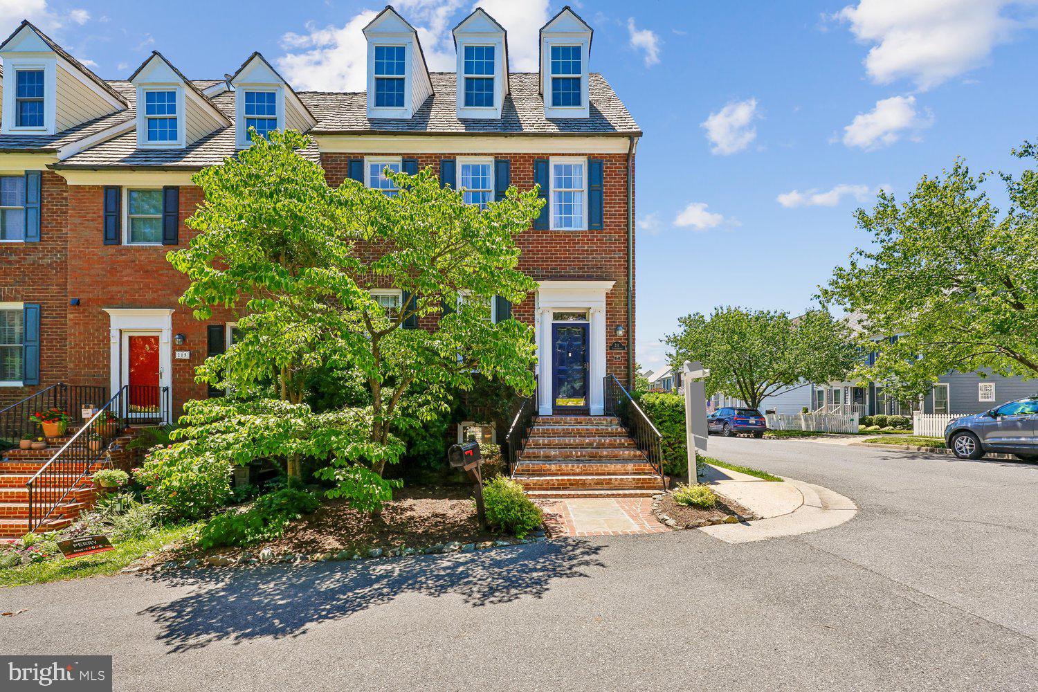This sunny end-unit townhome offers the extra living spaces that make this Kentlands’ home truly special. One of only a limited number of townhomes in the neighborhood with both a sunroom and rooftop deck, this home provides flexible indoor and outdoor living spaces that are rarely available. Anchoring the main level is a sunroom with windows on all sides. Above that, you will find a rooftop deck with panoramic views.  The outdoor living continues below with a beautifully landscaped backyard featuring stamped concrete hardscaping, a raised garden bed, and professionally designed year-round flowers, accessible from the covered patio. Offering approximately 2,400 square feet of living space plus an additional 144-square-foot sunroom, this home features hardwood floors and an open, airy floor plan. The main level includes a family room, dining area, and convenient powder room. The kitchen has been updated with painted cabinetry and newer appliances. Upstairs the primary suite includes a spa like en-suite designed for relaxation with an additional two bedrooms and a second full bath.   The fully finished lower level walks out onto the backyard, leading  to a two-car detached garage.   This level also includes a recreation area, full bath, laundry room, and a flexible space that can serve as a home office or workout room.  Located on the Dogwood Close this home provides easy access to the many neighborhood lakes and walking paths, parks and neighborhood amenities. It is just a short walk to the countless shopping, dining and entertainment this neighborhood has to offer as well as I270, The ICC and the Metro.