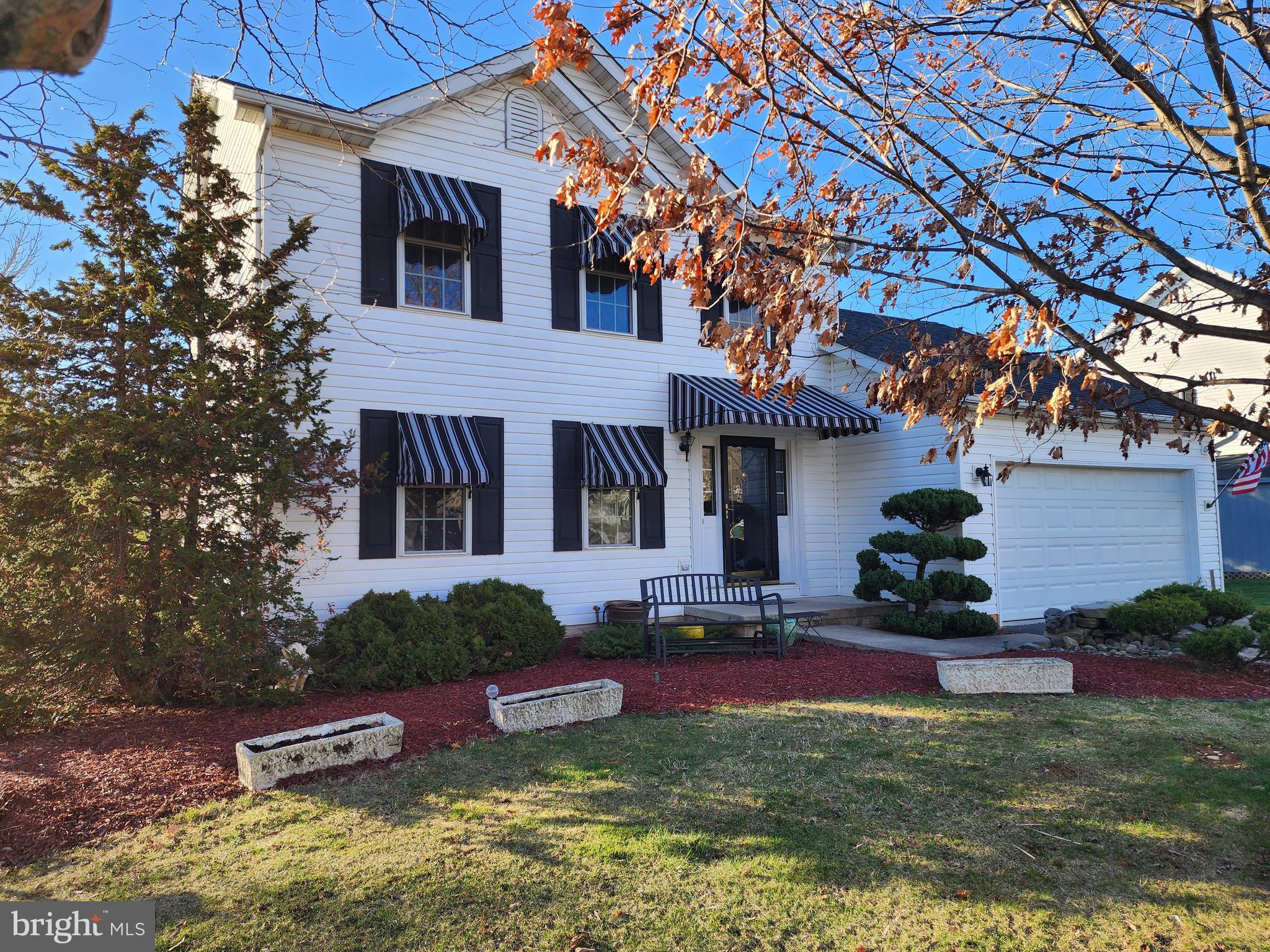 This Well Maintained & Move In Ready 3BR,  3 & 1/2 Bath ( The Primary & Hall Bath On The Upper Level Were Updated Including Heated Ceramic Tile Floors) Colonial Offers A Welcoming Entry Foyer, Parlor/Living Room, Formal Dining Room (Currently Being Used As A Home Office), Gorgeous Updated Kitchen - Custom Cabinets That Include A Pantry With Pull Out Shelving & All Slow Close Doors/Drawers, Granite On Countertops, Island And A Custom Dining Table & The Family Room Off The Kitchen Has a Gas Log Fireplace. The Entire Main Level Has Hardwood Flooring.  The Lower Level Has A 2nd Family Room With A Vermont Casting Gas Stove, Exercise Room (Could Have Numerous Other Uses), Play Area, A Wine Storage Room, 3rd Full Bath & 2 Compact Utility Rooms. The Lower Level Was Previously used As An In-Law Suite. There Are 2 Electric Hot Water Heaters To Provide Quicker Access To Hot Water On Main, Upper & Lower Levels. There Is Wring In A Utility Room For 2 Ceiling Mounted Speakers In The Kitchen  & 2 Wall Mounted Speakers On The Outside Deck & Patio Area. There Is An Outside Walk-Up Exit/Entrance From/To The Lower Level Family Room.  The Front Of The Home Is Accented With Lovely Awnings Over The Windows & Front Porch, Landscaping & A Water Fountain. From The Kitchen/Family Room You Can Exit To Both The 2 Car Garage & An Incredible/Large Multi-Level Composite Deck With Vinyl Railings & Retractable Awning, & A Covered/Private Ground Level Patio That Includes A Wood Burning Stove For Extended Use On Those Cool Days/Nights. Truly A Staycation Home For Entertaining Family & Friends!!! The Home Has A Security System That Is Currently Unmonitored. Located In Hagerstown's North End In Close Proximity to I-81, Hagerstown Regional Airport, Grocery/Convenience Stores, Restaurants, And Urgent Care Facilities. Don't Wait... Schedule Your Showing Today!!!