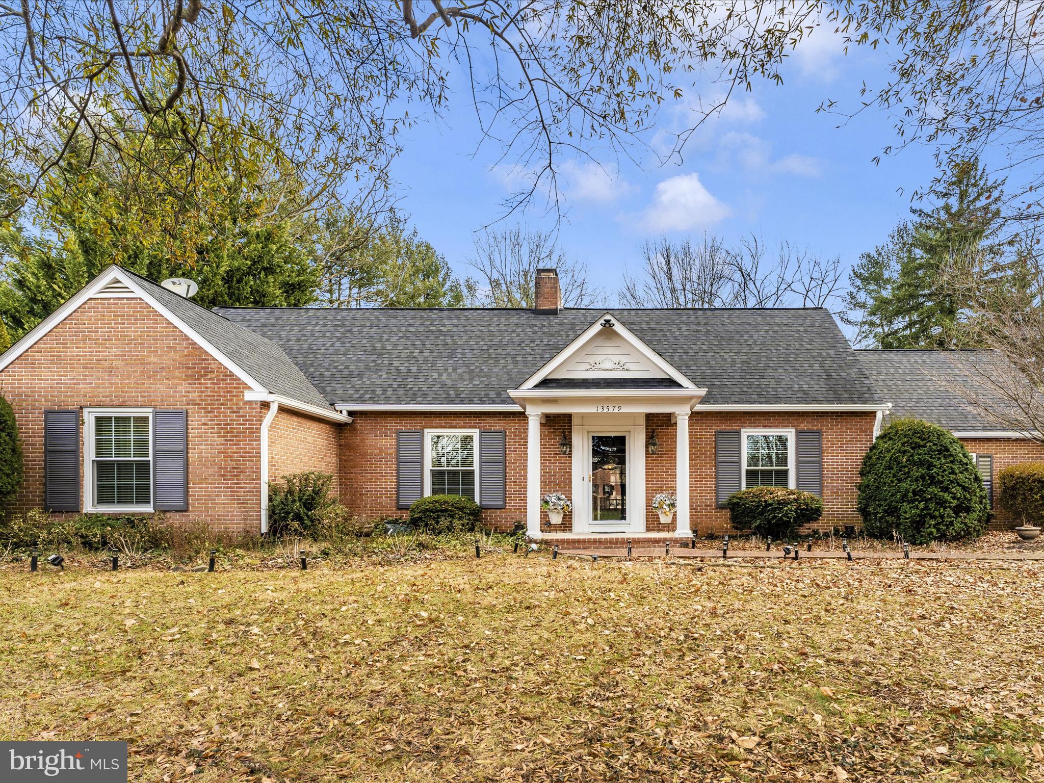 Stunning and unique home with exceptional quality throughout. Recently renovated with oversized rooms and storage areas and tons of natural light sitting on a half-acre parklike setting. Exceptional features abound including crown moldings on first floor, numerous built-ins, generous closet space, first floor owner's suite with dressing area, spa-like bath and over-sized shower as well as French doors to your own patio.  Dining, living, and kitchen overlook pond with three waterfalls adjacent to screened-in tiled and milled terrace. Gourmet kitchen with granite counters and newer stainless-steel appliances with built-in KitchenAid mixer! Hardwood and ceramic floors, two fireplaces, finished basement with wet bar. Leaf filter system and new gutters. Two car garage with insulated door.  Two oversized heat pumps for two zone heating/cooling and much more. No HOA and no city taxes. One year home warranty included.  Move right in and make it yours!