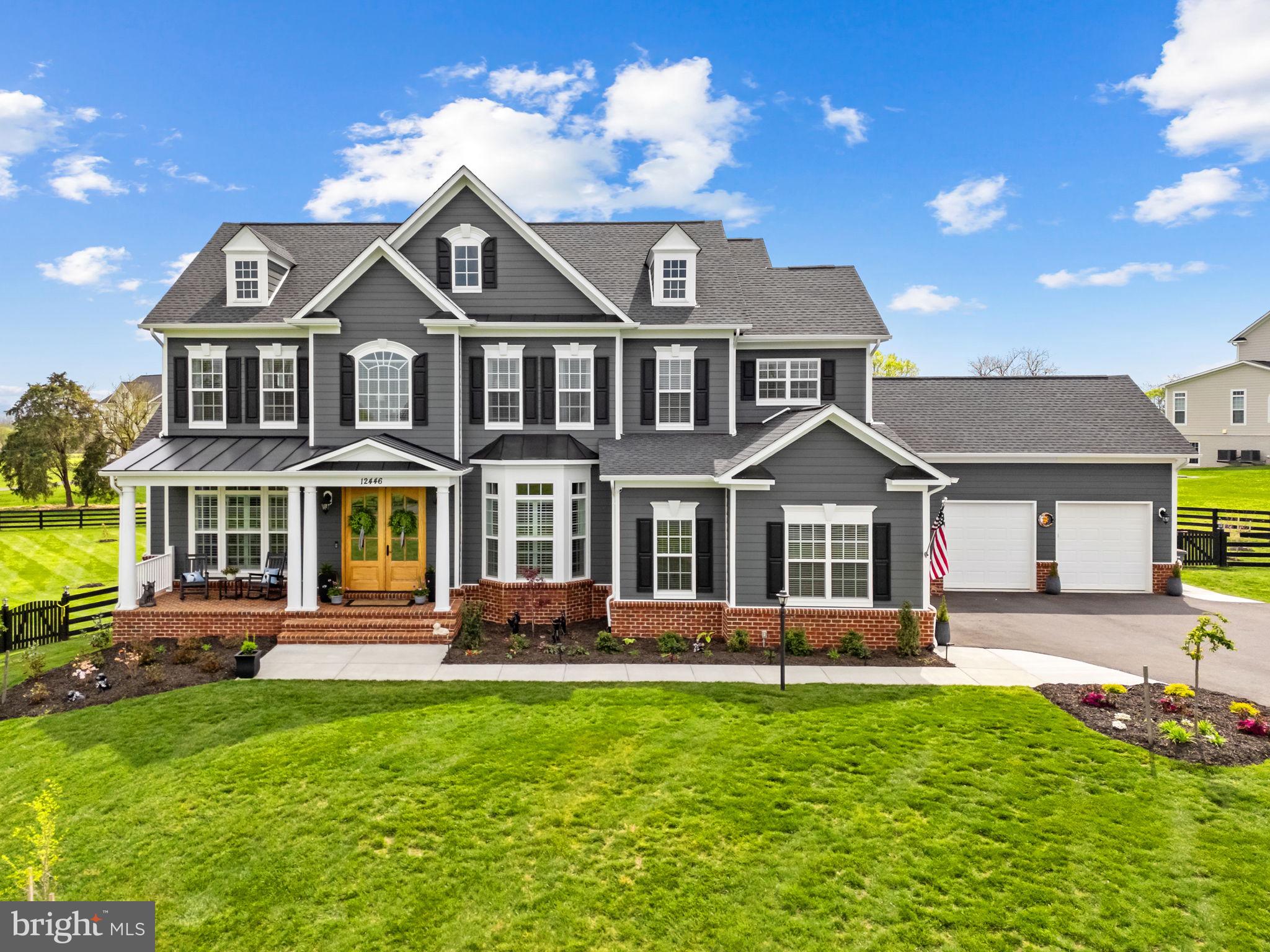 Welcome to 12446 Barrel Oak Lane, a home where every detail has been thoughtfully refined and properly handled.

Set on 1.81 acres of flat, open land in the heart of Lovettsville, this Carrington Homes Huntwick Place model offers over 6,300 square feet of beautifully finished living space, enhanced by more than $150,000 in intentional post-sale upgrades.

From the moment you step through the signature double front doors, the tone is set. The main level unfolds with warmth and clarity, designed for both everyday living and meaningful gatherings. At the center of the home, the kitchen has been elevated with a full suite of top-of-the-line KitchenAid appliances, including a counter-depth refrigerator, dual ovens, a 36-inch gas cooktop, and an upgraded dishwasher. New pendant lighting and a refined breakfast area fixture add a soft, modern finish, while the adjoining bar area, complete with an arabesque backsplash, floating shelves, and refrigerator drawers, makes hosting feel seamless.

The family room offers a sense of quiet comfort, anchored by a coffered ceiling and gas fireplace, while the main-level offices provide flexibility for work, creativity, or additional living space. A formal dining room and game room create natural places to gather, all connected by updated finishes and thoughtful design.

The home is equally thoughtful in its everyday functionality, featuring two separate two-car garages, both fully finished with epoxy floors, offering a polished and practical approach to storage, hobbies, or additional workspace. Just inside, a well-designed drop zone creates a seamless transition into the home, bringing ease and organization to daily life.

Upstairs, the primary suite serves as a private retreat, enhanced with updated lighting, Kohler fixtures, and a spa-like bath with a soaking tub, frameless glass shower, and dual vanities. New continuous flooring throughout the second level creates a clean, cohesive flow, while additional bedrooms offer both comfort and privacy for family and guests.

The walk-out lower level extends the home’s versatility with a spacious recreation area, custom wet bar, private guest suite with an en-suite bath, and a dedicated gym or media room. New carpeting with upgraded plush padding and specialty gym flooring adds both comfort and function.

Beyond aesthetics, the home has been meticulously maintained and improved for long-term confidence. A new 17 SEER Trane multi-fuel HVAC system, smart thermostats, a serviced whole-home water filtration and softener system, radon mitigation, and a replaced septic pump ensure the home operates exactly as it should. The interior has also been freshly painted throughout, creating a clean, cohesive backdrop that feels both elevated and move-in ready.

Outdoor living has been equally considered. A stamped concrete patio, expanded deck access, improved drainage, an extended front walkway, and thoughtfully added landscaping create a setting that feels both open and intentional, perfect for quiet mornings, gatherings with friends, and everything in between.

Located just minutes from Market Table Bistro, Train to Mumbai, Andy’s, and the Lovettsville Co-Op, this home offers not just space, but connection to one of Loudoun County’s most charming communities.

This is more than a home. It is a place where your next chapter begins, already aligned.