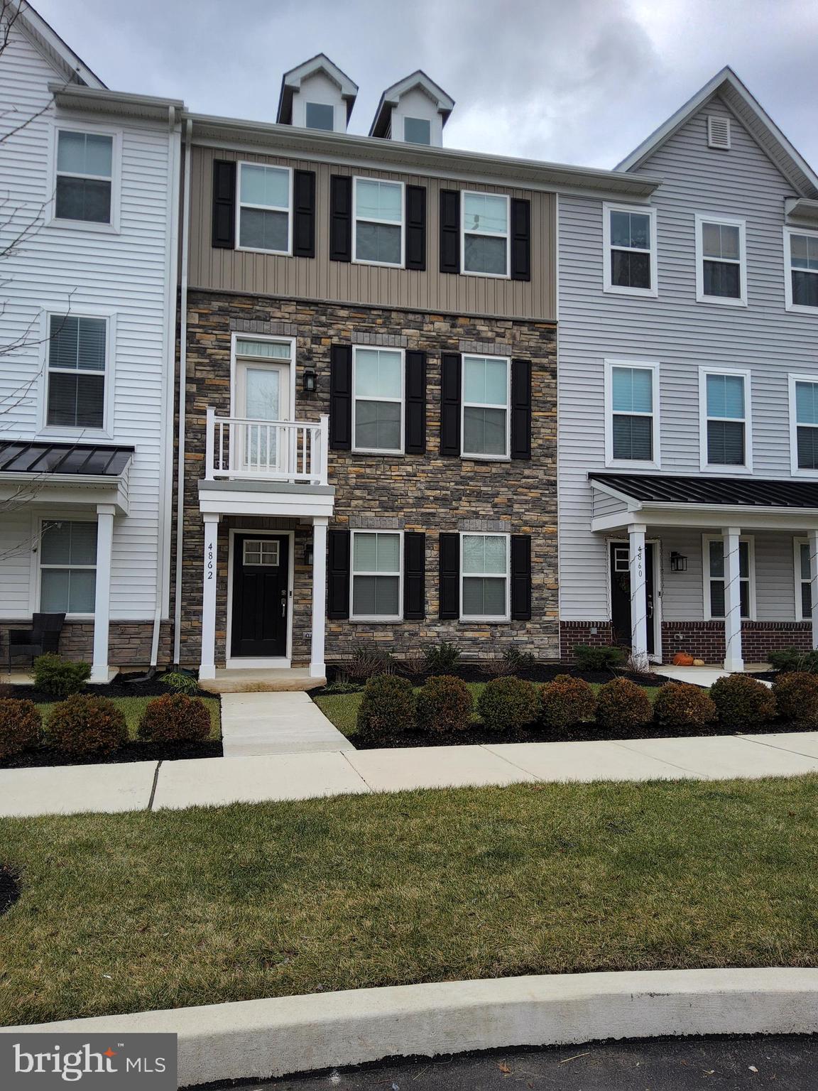 Do not wait to schedule an appointment to see this beautiful Pipersville rental.  This 2 year young, gorgeous townhouse is waiting for you to view.  It is part of the Lennar townhome community of Lantern Ridge.  This unit is the Harper model.  Pull up to this modern style townhome with a beautiful stone front  and tastefully selected siding.  You will notice the nice landscaping in the front.  If you park out front, you will enter into the Main level where there is the 2 car garage access into the home as well as a Bedroom that has it's own full bath with a walk in shower.  This could be used for in-laws, the primary or a guest room.   Access to the 2 car garage is on this floor.  Garage is rear facing and there is also driveway parking behind the home.  Head on up to the 2nd level where you will find the main living space.  This level has the Living Room, a half bath, the Kitchen, and Dining Room.  The Living Room is of nice size and is open to the Kitchen.  The kitchen is to die for!  This kitchen is white and has amazing granite countertops, lots of storage in the cabinetry, an island that is enormous and has plenty of storage underneath.  The appliances are all stainless steel and 2 years old.  There is a gas cooktop,  refrigerator, dishwasher, oven, microwave and a rangehood.   White subway tiles are the backsplash for this amazing kitchen.  Nothing was overlooked when they put this kitchen together.  The flooring is a dark plank style that really compliments the brightness of the rest of the kitchen.  Even though this home has natural lighting, it has recessed lighting as well.  The Dining Room is right next to the Kitchen and has direct access to the deck for outdoor entertaining.  Don't forget the walk in pantry if you need more storage!   Go up one more level to find the Primary Bedroom Suite complete with tray ceiling,  primary bathroom with a walk in shower and dual vanities.  You will also find the 2nd and 3rd bedrooms that share a hall bath and it has a tub.   The laundry room is also on this level.  Snow removal and lawn care is included as well as trash.  Landlord pays the HOA fees.  If you haven't heard enough to schedule an appointment, then how does walking to restaurants and stores sound?  Public transportation nearby for commuters.  Landlord is looking for smoke free tenants.  Pets are on a case by case basis and landlord reserves the right to decline based on size, breed or number of pets.