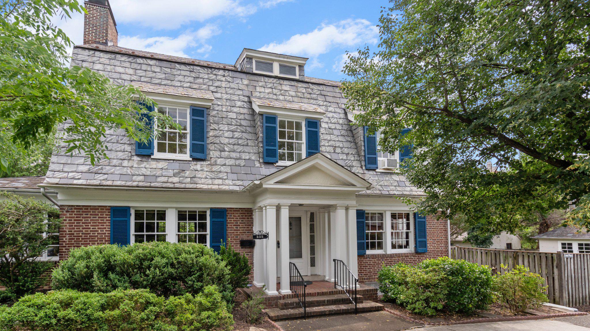 Rarely available and rich in historic character, this exceptionally maintained Colonial located in close proximity to the sought after Johns Hopkins Homewood Campus is a true Baltimore City treasure. Situated on a prominent corner lot, this distinguished residence showcases timeless curb appeal with its classic brick and stucco exterior, slate roof, professional landscaping, fenced rear yard, and highly sought-after two-car detached garage.

Step inside the grand foyer, where soaring ceilings and hardwood flooring set the tone for the craftsmanship found throughout. The stately living room is a showpiece, featuring gleaming hardwood floors, exposed beamed ceilings, crown molding, and a fireplace. Glass-paneled doors open to a bright sitting room surrounded by walls of windows, creating the perfect space to relax or entertain. Opposite the foyer, the formal dining room provides an elegant setting for gatherings and flows seamlessly into the updated gourmet kitchen.

Designed with both style and functionality in mind, the oversized eat-in kitchen offers hardwood flooring, white cabinetry, quartz countertops, a ceramic tile backsplash, stainless steel appliances including a sub zero refrigerator and bosch commercial grade stove, recessed lighting, crown molding, a ceiling fan, and generous table space. A stunning wall of French doors fills the space with natural light and provides seamless access to the rear brick paver patio, creating the ideal indoor-outdoor entertaining experience. A convenient powder room completes the main level.

The second level features four spacious bedrooms, all with hardwood flooring, and a full bathroom. One of the bedrooms includes an adjoining sitting room, offering flexible space ideal for a home office, nursery, dressing room, or private retreat. The top level hosts two additional bedrooms, including the expansive primary suite. The primary suite features a private bath highlighted by a custom ceramic tile shower with a built-in niche and recessed lighting.

The unfinished lower level provides abundant storage space, a flush, and houses the laundry and utility areas including an updated gas fired boiler and updated gas hot water heater. Combining timeless architectural details, thoughtful updates, professional landscaping, and the rare convenience of a two-car detached garage, this remarkable home presents a unique opportunity in one of Baltimore City's most desirable locations. Ideally situated with close proximity to the Johns Hopkins Homewood Campus, dining, shopping, cultural attractions, and major commuter routes.