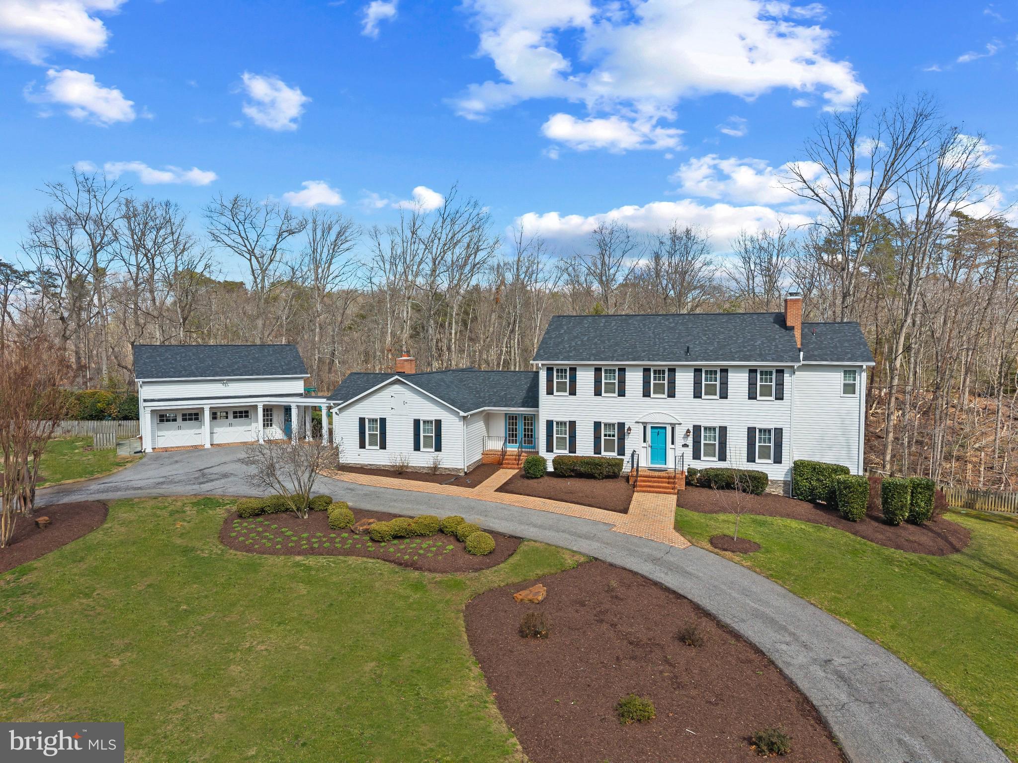 This beautifully updated, move-in ready 6-bedroom, 5 bathroom home is ideally located on a cul-de-sac in highly sought-after Harbor Hills waterfront community.  
Upon moving in in 2019 the owners made several upgrades to the interior and exterior of the house.  In 2021 the first floor area was completely renovated to open up kitchen and sunroom to the rest of the house.  The kitchen is a true show stopper and perfect for entertaining and family gatherings with a quartz island with seating for 6.  The kitchen is equipped with a beautiful farm sink as well as a prep sink in the island for ease.  Quality appliances throughout including a 36 inch column Thermador refrigerator and 18 inch Thermador freezer for plenty of space for a family. 
Upon entering the home from the detached garage there is a completely renovated mudroom with custom cabinets and lockers for storage for 4, shiplap throughout that continues through the first floor into the kitchen and sunroom.  The mudroom is also equipped with a  stackable washer and dryer for those pool towels when you come in from the pool area.  A separate laundry room on the other side of the house has a full size washer and dryer, brand new flooring, tons of storage cabinets, as well as a pantry.  
The first floor has a guest bedroom and full bathroom, as well as formal dining room.  Upstairs are 4 bedrooms including the primary suite with two walk in closets.  In 2019 new windows were installed throughout, 61 in total.  New roof installed in 2025 on the home and detached garage as well as new columns on the detached garage.  
The detached garage has shelves for storage in the main area and tons of storage on the second floor including a separate area with infrared heating panels installed for a hot yoga room, could be converted to work out room or office.  Fully finished basement with new floors and fresh paint, also includes a back room with infrared sauna.  
Step outside from one of your many entry and exit points to a true-backyard oasis.  A beautifully designed pool with plenty of space for relaxing and entertaining.  Beyond that is a fully lighted sport court for endless days with basketball or pickleball.  A perfect space for outdoor entertaining for the adults, kids, and their friends to play.
Harbor Hills enriches everyday life with an exceptional array of amenities. Residents enjoy a community pool and clubhouse that serve as the hub for social gatherings, along with tennis courts and a baseball field for recreation. The waterfront setting offers a beach, boat ramp, and marina for easy access to the water, while the waterfront pavilion provides the perfect backdrop for sunset evenings and community events. A playground and open spaces complete the setting, creating a neighborhood designed for connection, activity, and enjoyment.
Experience a lifestyle defined by the balance of privacy, recreation, and community where every day feels like a retreat and every season brings something to enjoy Welcome Home!