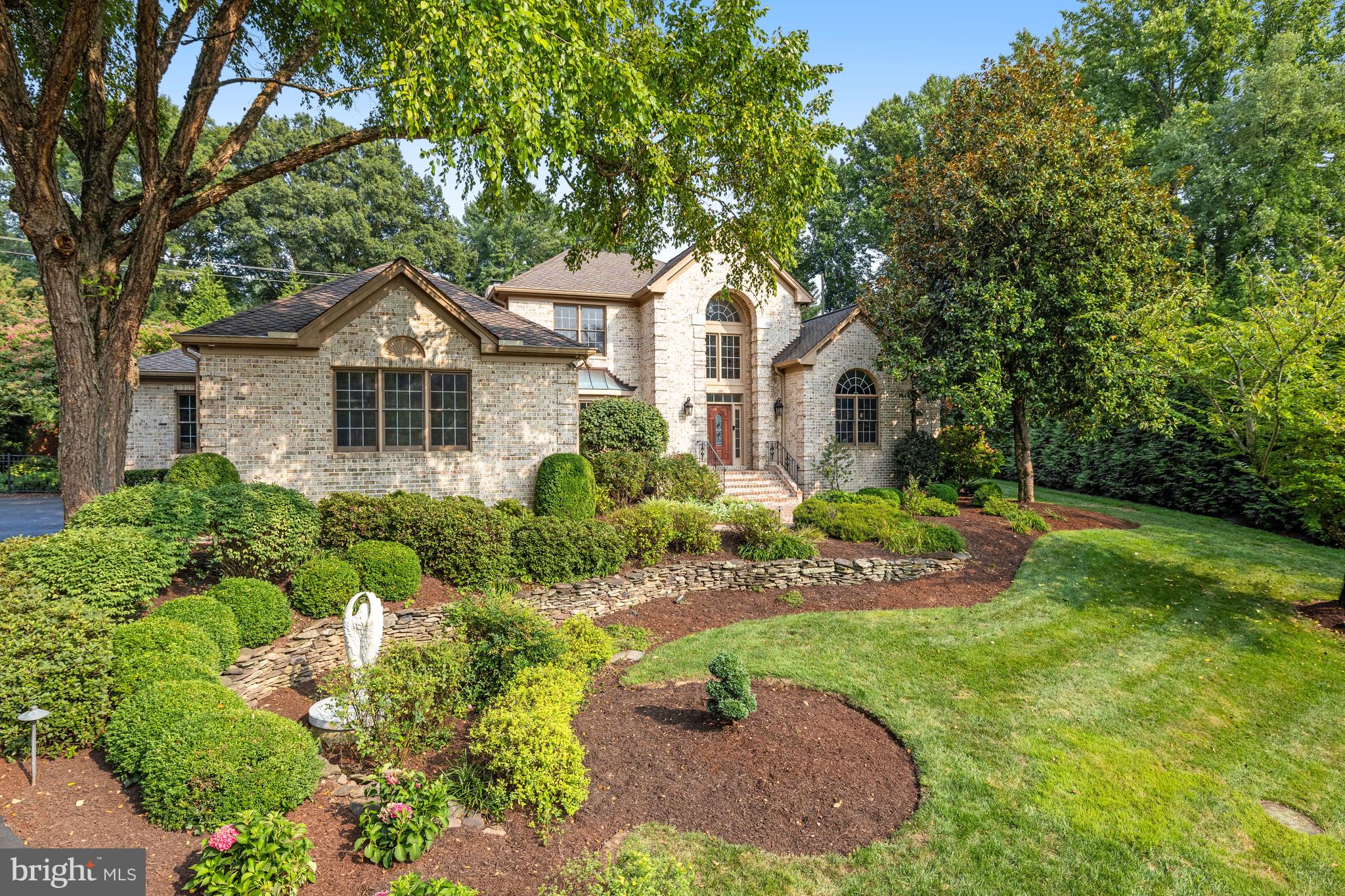 Impressive all-brick 5 Bed | 5 ½ Bath home on .84 acres on a double cul-de-sac street, with over 5,900 sq ft of living space on three levels! Fully fenced rear and side yards with mature landscaping and fabulous entertaining area in the back. Gorgeous heated, saltwater pool with remote control waterfall feature and separate in-ground hot tub spa, outdoor gas fireplace with water feature and plenty of room for multiple seating areas on the hardscaped pool deck. The main level has a great flow featuring a first floor primary suite - with vaulted ceilings and see-through gas fireplace and plenty of closet space. The Lobkovich-designed primary bath has heated floors (even in the Steam Shower!), double vanity, separate jacuzzi tub with lighting and deck with direct access to the patio and pool. Lobkovich-designed gourmet eat-in kitchen with Wolf, Miele and Sub Zero appliances featuring a large center island with 6-burner, dual-fuel range, two dishwashers, undercounter wine fridge, ice maker and heated floors! Additional main level living areas include a home office with custom built-ins, formal dining room and living room and a relaxing family room off the kitchen with a fabulous stone-front gas fireplace. A large mudroom with full bath, heated tile floors, laundry and plenty of custom built-in storage leads directly to the 3-car side load garage. Lower Level has a bedroom and full bath, large rec room area with gas fireplace, exercise room, wet bar and lots of storage, including a cedar closet.

Notable features include: Hardwood floors throughout, high ceilings with recessed LED lighting on all 3 levels, custom lighting in the Jacuzzi tub, indoor/outdoor speakers with multiple zones – can listen to different music outside and multiple zones inside via the Sonos System (or directly from your phone!), Hunter Douglas custom silhouette shades, 3-car side load garage w/ epoxy floor, custom cabinets and electric vehicle charger, irrigation system and uplighting. Langley High School pyramid. Close to Rts 7 and 267 and 495, downtown McLean and Tysons, Great Falls and multiple parks with hiking trails.

We are requesting for offers to be in by Wednesday, August 21 at 2:00pm.
