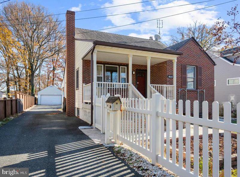 Great new price to kick off the Spring season!! This 1864 finished square ft move in ready and conveniently located brick cape cod has so much to offer! Covered front and back porches, main floor living,  huge garage/workshop, new LVP flooring on main level, fully finished lower level and even a picket fence! Beautifully updated kitchen with stainless appliances, double oven, huge sink and solid surface countertops. The custom woodwork throughout shows the true craftsmanship of this home.  The two upper level bedrooms have been opened up to a combined bedroom with loft/sitting area. Easily closed off if you need that extra bedroom.  The finished lower level with walk out to back yard is a blank slate of possibilities. In-law suite? Home office? Extra bedroom? Billiards room? Craft room? Family room? You choose! Tons of parking options between the large paved private driveway, 2 car oversized garage and street parking. The spacious almost quarter acre privacy fenced yard is just waiting for you to bring your friends, your fire pit and some smores.  Situated on a quiet street but easy access to 702, 695, 95 , White Marsh as well as parks, marinas and tons of great restaurants. Come out and take a look at 1623 Howard Avenue. Your new home is waiting!