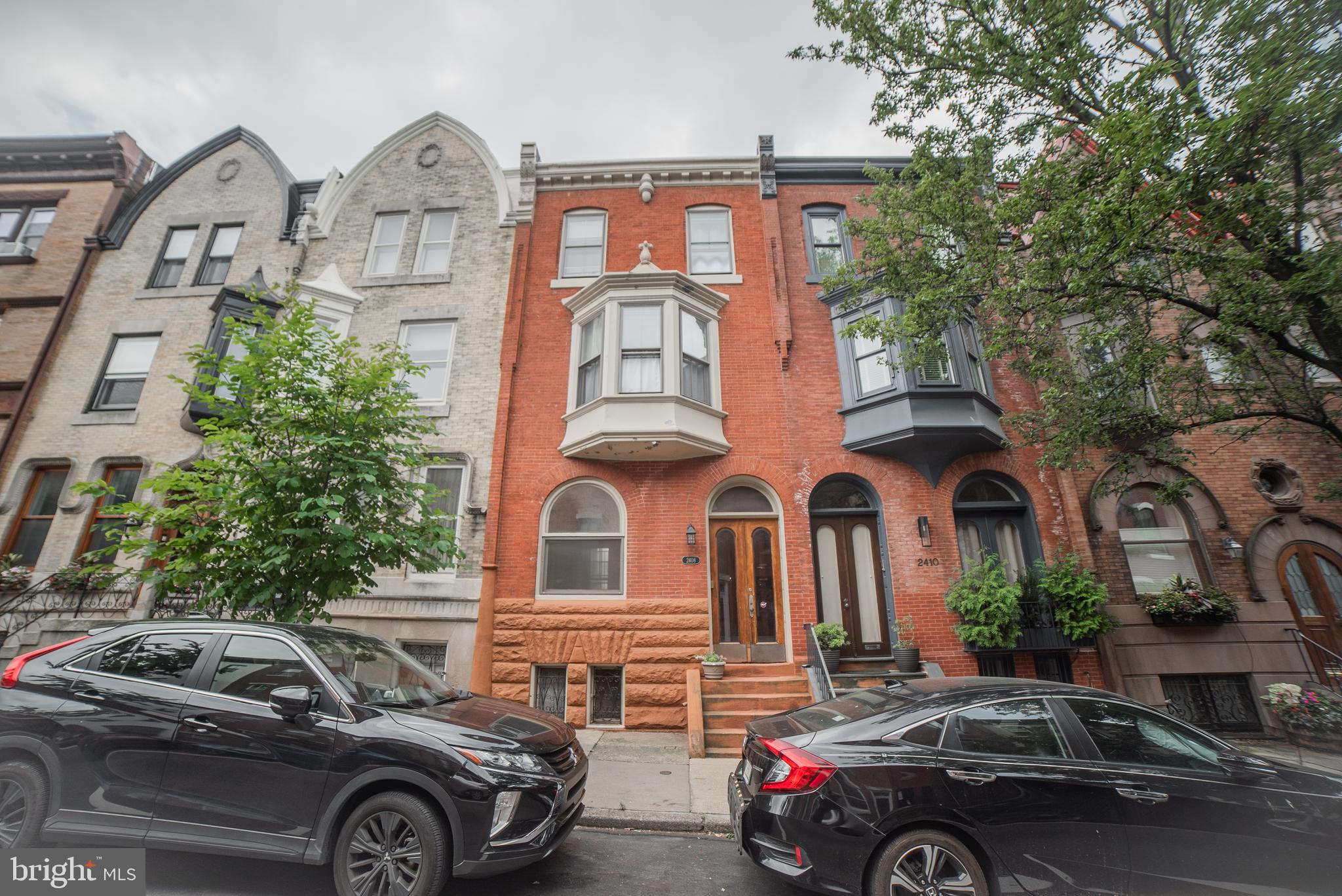 5 unit Rowhouse a half block from Schuylkill River Park, easy access to shops, markets and universities.
Original tiled entry foyer with wood wainscotting.  1 floor front is a studio with wood floors, and split system heating and cooling unit.  1 floor rear is a bilevel one bedroom with a bay window.  Upper level is the bedroom with wood floors and tiled bath. Lower level is the living room and kitchen with updated laminate floors. There is access to a rear patio. This unit also has split system heating and cooling.  2nd floor front is a one bedroom with wood floors and a bay window in the living room.  2nd floor rear is a studio with wood floors, bay window and tile bath. 3rd floor is a two bedroom, the tiled bath has a new vanity, the kitchen has new quartz countertops, open to the living room wood floors and a balcony.  This unit also has split system heating and cooling.   There is a gas fired boiler for the second floor units and a washer/dryer for all the tenants in the basement.   The property is in good condition in a great location.