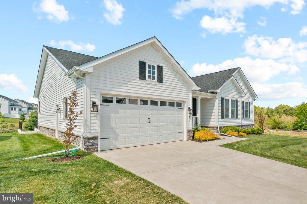 Rare opportunity in sought-after Walnut Reserve - over 4000 square foot rancher style with 5 bedrooms!  This new construction development is sold out. This model features over 4000 square feet  which showcases extensive builder upgrades paired with thoughtful custom enhancements throughout. Meticulously maintained and truly move-in ready, the spacious ranch-style Melody floor plan is designed for effortless living and entertaining.

The main level features an expansive great room that flows seamlessly into a chef’s kitchen, complete with high-end finishes and access to an oversized sun deck—perfect for indoor-outdoor gatherings. The luxurious primary suite offers a generous walk-in closet and a private, spa-inspired bath. A separate wing provides two additional large bedrooms and a beautifully customized full bath, ideal for guests or family.

An extra-wide oak staircase leads to a fully finished, expansive lower level designed for entertaining, featuring a stunning custom bar and wet bar. This level also includes two additional bedrooms and a dedicated gym or flex space, offering versatility for any lifestyle.

Set within a dog-friendly community, residents enjoy convenient access to shopping, dining, and entertainment, along with easy commuting via I-795, I-695, and I-95. Walnut Reserve is also within walking distance of a resort-style community center offering family-friendly recreational amenities, a performing arts venue, and more.