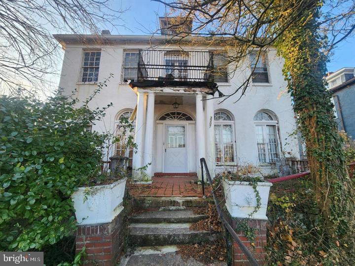 Massive single-family home in need of full rehab. There is a partially finished attic for additional space and an alley-facing two-car garage. Potential multi-family usage with a second story entry/exit in the rear. Sold As-Is, Cash/ Hard Money.