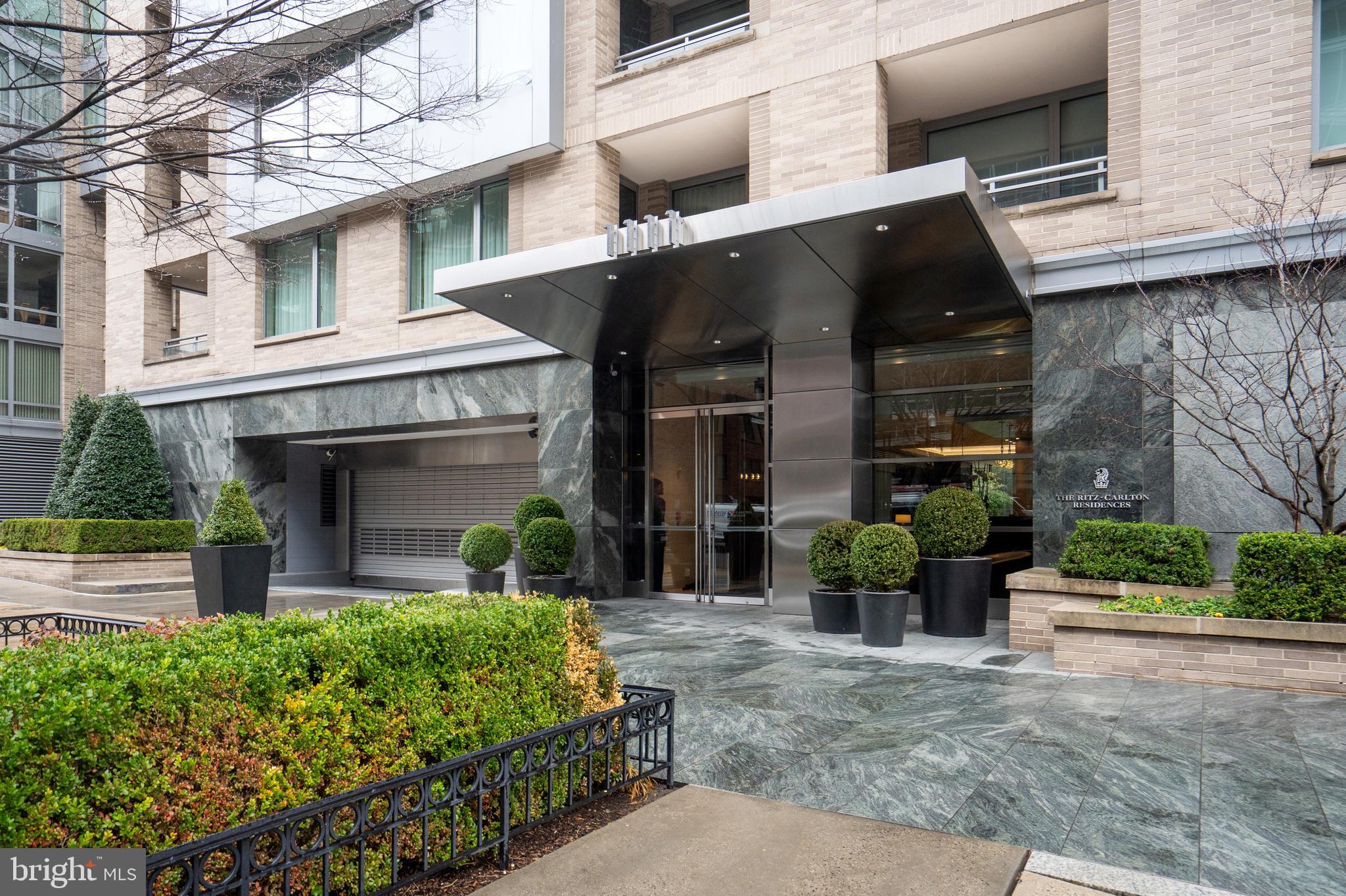 Significant Price Reduction!  This extraordinary condominium home at the Ritz-Carlton Residences with 40 foot private terrace, 2 bedrooms and 2.5 bathrooms is not to be missed!  Thoughtfully updated throughout, 2D South offers both style and comfort.  Enter via the large scale entry hall which connects to the gracious formal living room, dining room featuring designer wallpaper, and private balcony.  The gourmet chef's kitchen has quartz countertops and high end appliances including a separate wine fridge and lots of storage.  The luxurious primary suite is oversized and sunlit with three double closets and a spacious marble bathroom with dual sinks, shower and separate bathtub.  Leisurely walk out onto your private 40' terrace with two seating areas and views of the lush and peaceful interior courtyard.  The second bedroom suite also overlooks the terrace and includes a handsome built-in desk space along with two double closets and a full bathroom.  This unit has all the conveniences including a designer powder room, in-unit washer/dryer and garage parking space.  A world class building in an ideal West End location offering Ritz-Carlton services, 24-hr concierge, doorman, valet parking, security and more!