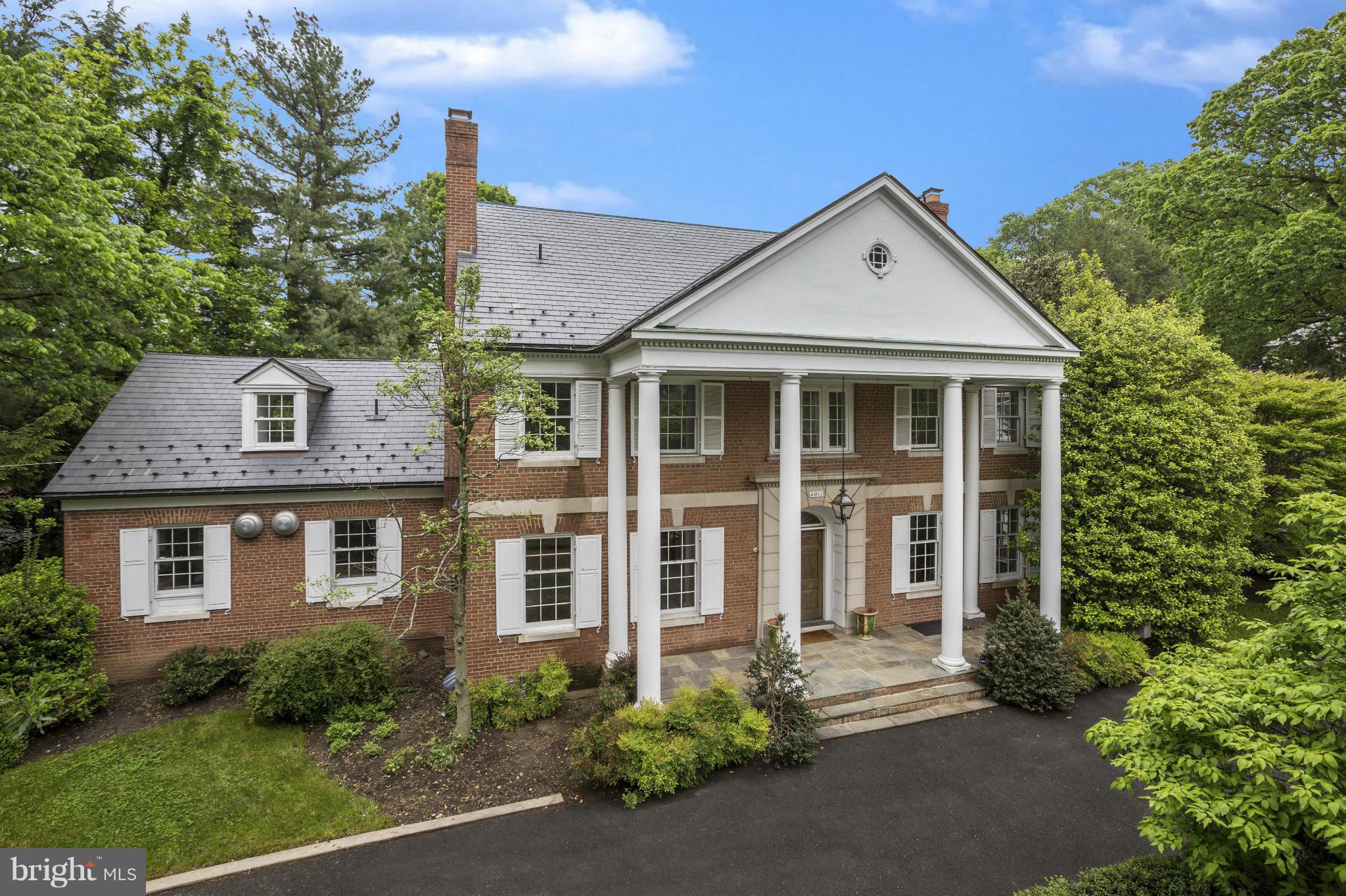Sprawling home on prestigious Loughboro Road.  Set back with a private circular driveway, private garage and lush yard.  Recently renovated kitchen.  4 levels perfect for family living and entertaining with optional first floor master suite. A must see!
