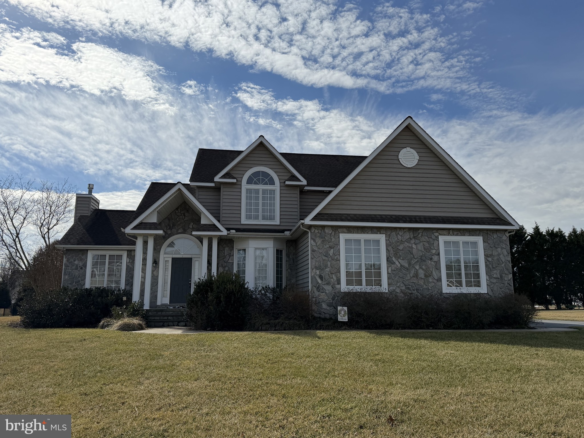 This spacious 5 bedroom, 3 bathroom home is a must-see! As you enter the main floor, you are greeted by a living room with a beautiful vaulted ceiling and a cozy stone fireplace. The large kitchen features plenty of cabinets and countertop space, perfect for those who love to cook and entertain. Additionally, there is a formal dining room and a sunroom, providing ample space for gatherings with family and friends. The main floor also includes a bedroom and a full bathroom, offering convenience and flexibility for guests or family members. Hardwood floors flow throughout the main floor, adding warmth and elegance to the space. Upstairs, the primary bedroom boasts a vaulted ceiling and a spacious walk-in closet, providing plenty of storage space. The primary bathroom is a true retreat with his and hers vanities and a luxurious jetted tub, perfect for relaxing after a long day. The finished basement adds even more living space to this already impressive home. Outside, a rear deck offers a wonderful spot for outdoor dining or simply enjoying the peaceful surroundings. With a 2 car garage, there is plenty of space for vehicles and storage. Don't miss out on the opportunity to make this stunning property your new home!.   For financed offers EMD to be 1% or $1000 whichever is greater and for cash offers EMD to be 5% or $5000 whichever is greater. All offers are subject to OFAC clearance. Subject to seller addendum. Property is being sold As Is.