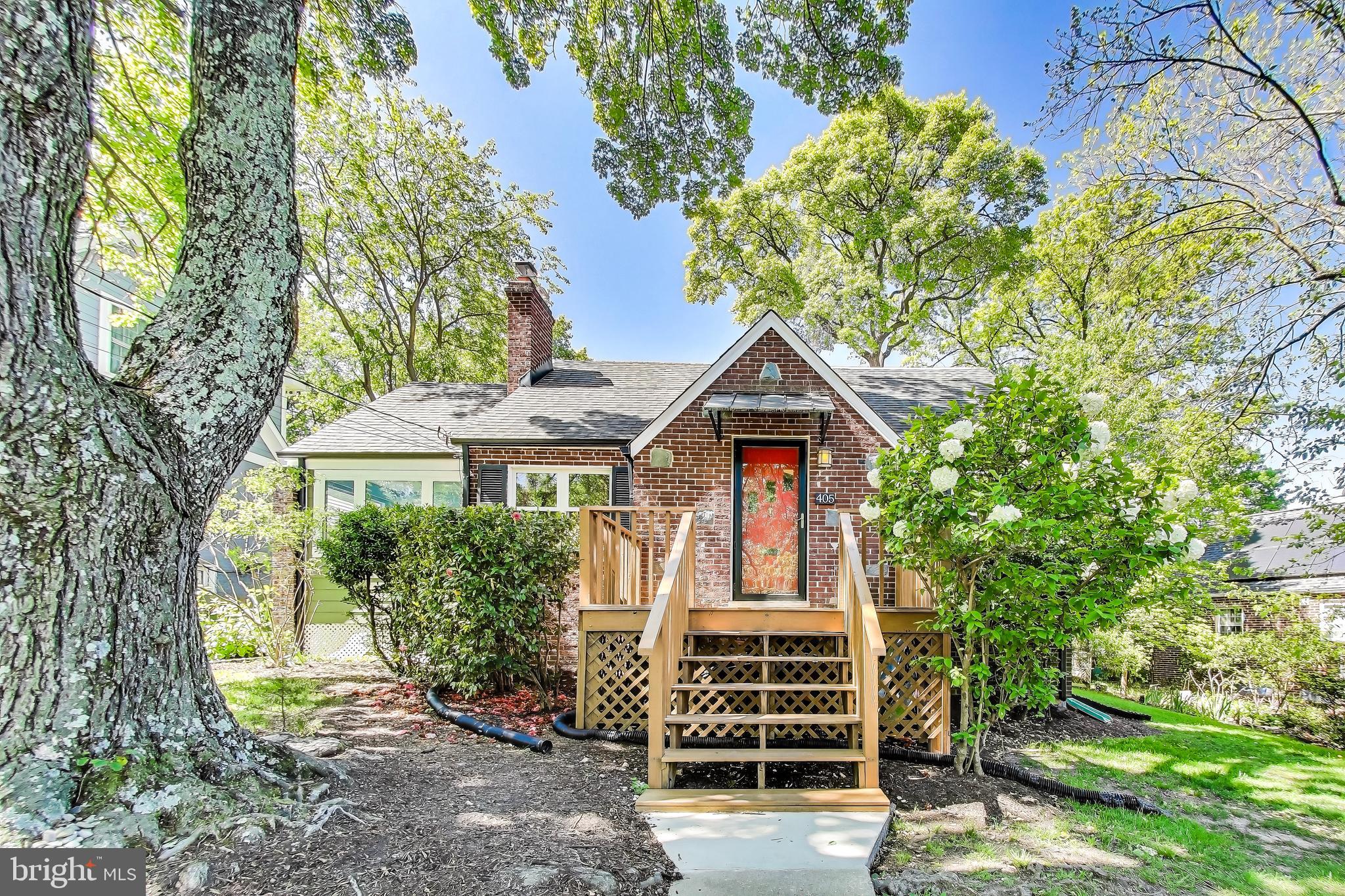 Deadline for Offers: Tuesday 5/20 at 2pm. This charming expanded cape cod offers a surprising amount of space on a beautifully landscaped lot in the heart of Takoma Park.

At the front, you'll find a large front stoop, perfect for a chair or two for the evening chat with neighbors. Inside the front door, the front entry has a hall closet and a space for a great bench or table - great for keys, shoes, and leaving those packages for return at the door so you don't forget them!

The living room space offers the original woodburning fireplace, refreshed with black painted brick, hardwood floors, and a large window to the front yard. Tucked around the corner, you'll find the kitchen and dining room. The dining room has plenty of space for a large dining table, and is just separate enough from the living space to be perfect for those of us who would love a little less totally open concept spaces. The kitchen has stainless steel appliances, painted gray cabinets, granite countertops, and an always-in-style white subway tile backsplash.

Off the kitchen and dining spaces are two bonus spaces that make this cape cod live larger - an eat in kitchen area, currently used as a morning coffee and cuddles lounge area, and a small office space perfect for the work from home set ups.

Back at the living room, the first of two bedrooms is directly off the living space - the bedroom's large windows bring brightness until the living room as well with the large shoji-screen barn doors, allowing this bedroom to function as a full time bedroom space, a den, or another office space. Down the hall, you'll find another traditional bedroom and the first floor full bathroom.

Upstairs, the attic space has been delightfully converted into a luxurious primary suite, with a large walk in closet, additional built in storage shelves along the eaves, and a bedroom with sitting room and full en suite bathroom.

Downstairs, the basement space is partially finished, with a large two part family room - perfect as a play room, craft space, or a spot to jam on the guitar while playing your favorite records. In the unfinished space, newer washer and dryer are right off the stairs for easy access, and a ton of storage space around the new HVAC system.

Over the last 10 years, the owners have done an excellent job caring for and updating the home including: new roof (2016), new hot water heater (2017), chimney repair (2019), new dishwasher (2020), heavy-up electrical (2021), new attic HVAC (2021), new microwave (2021), new siding (2021), new windows and exterior doors (2021), new gutters (2021), added insulation (2023), new sump pump (2024), new washer/dryer (2024), and new HVAC (2025).

This home is located in the heart of Takoma Park, just three blocks from Sligo Creek Park & trail, a half mile from Takoma Food CoOp, Cielo Roja, Spring Mill, Soko, a mile from downtown Takoma and a 10 minute bike ride just beyond that to the Takoma metro.