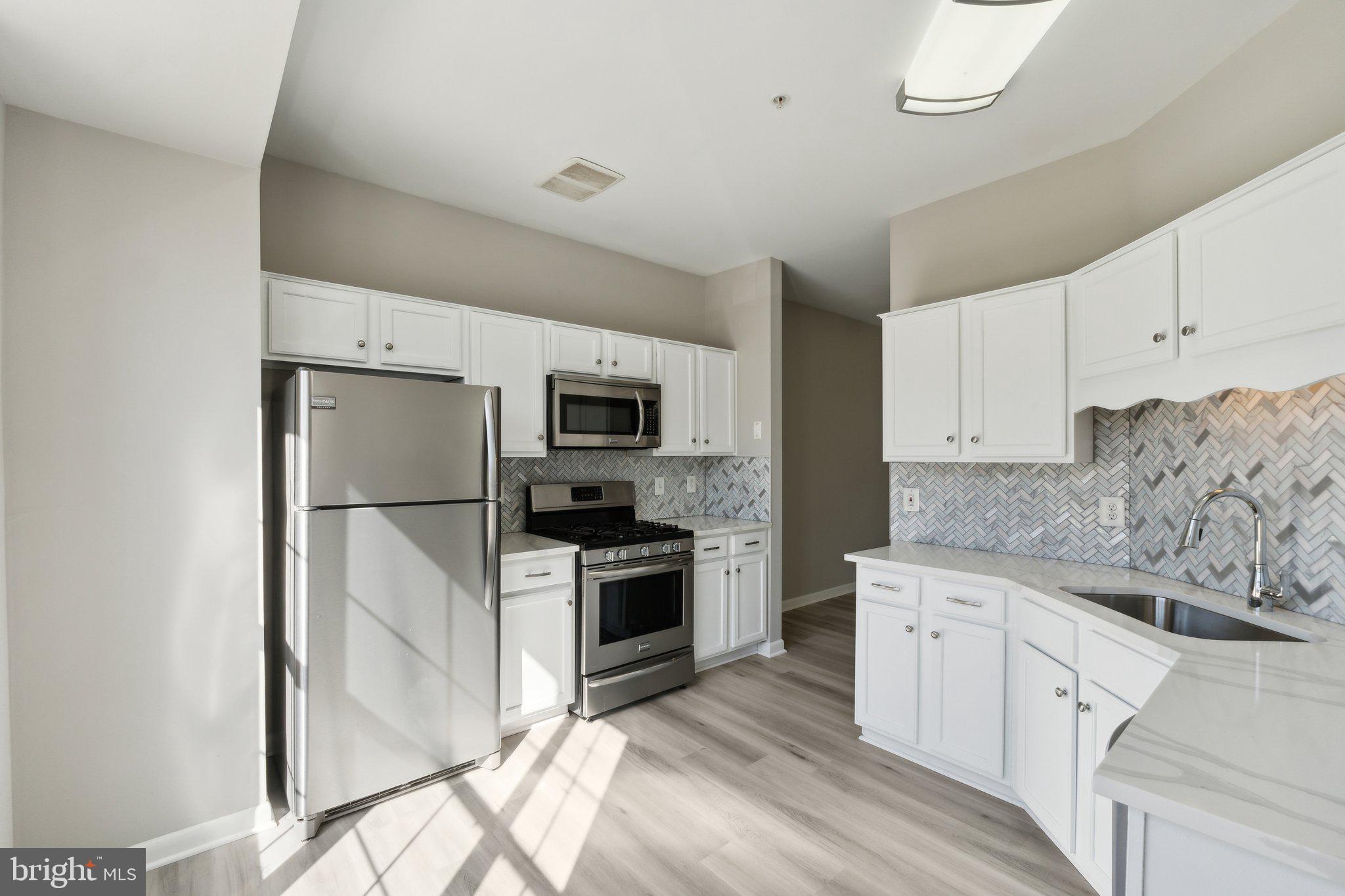 Welcome to this beautifully updated home that blends modern upgrades with fantastic community amenities! Step inside and discover freshly painted walls, new chandeliers and sleek LVT flooring throughout, offering a stylish, low-maintenance living space. The kitchen is a true standout with brand-new quartz countertops and a contemporary backsplash, making meal prep and entertaining a breeze. Exterior wood on the small deck and wood trims have been refreshed. Enjoy sitting outside with a cup of coffee! Or, sit next to the fireplace inside to stay warm. The master bedroom features recessed lighting, adding a touch of elegance and comfort.

This home is carpet-free, providing clean, easy-to-maintain floors in every room. You'll also appreciate the attached one-car garage with a brand-new motor and a driveway, providing space for additional parking.

Living here means enjoying an abundance of community amenities, including six refreshing pools, soccer, basketball, and baseball fields for active fun, and jogging and biking paths for outdoor enthusiasts. With lake access, you can enjoy a variety of lake activities right at your doorstep. Plus, the brand-new Lakeforest Shopping Development is coming soon! This walkable shopping center will offer lakeside dining, bringing convenience and a lively atmosphere just around the corner.

This property offers not only a stunning home but also a vibrant, active lifestyle. Don't miss the opportunity to make it yours! OFFERS, IF ANY, DUE BY 4/1/25 AT 5:00 PM.