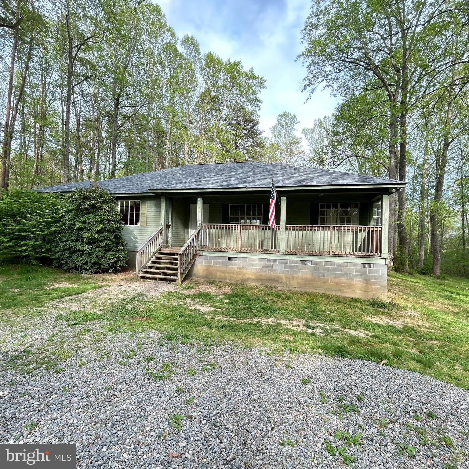 DO NOT MISS THIS OPPORTUNITY TO OWN A 1752 sqft home all on one level with three bedrooms and two full baths!  Yes this home needs work but look at this price!  The roof was installed in 2024 now the rest is up to you.  This cozy rambler is perfect with its sprawling open floor plan and high ceilings, with a formal dining area offering access to the covered rear deck and open to the living room.  Plus an eat in kitchen with window filled table space.  Large second and third bedrooms and its fantastic primary suite with private full bath, walkin closet, sitting area with its own private access to the covered rear deck.  This home is perfect for investors, buyers willing to add their own elbow grease for instant equity!  All on 1.4 acres...so bring your four wheelers, get ready to enjoy country life!