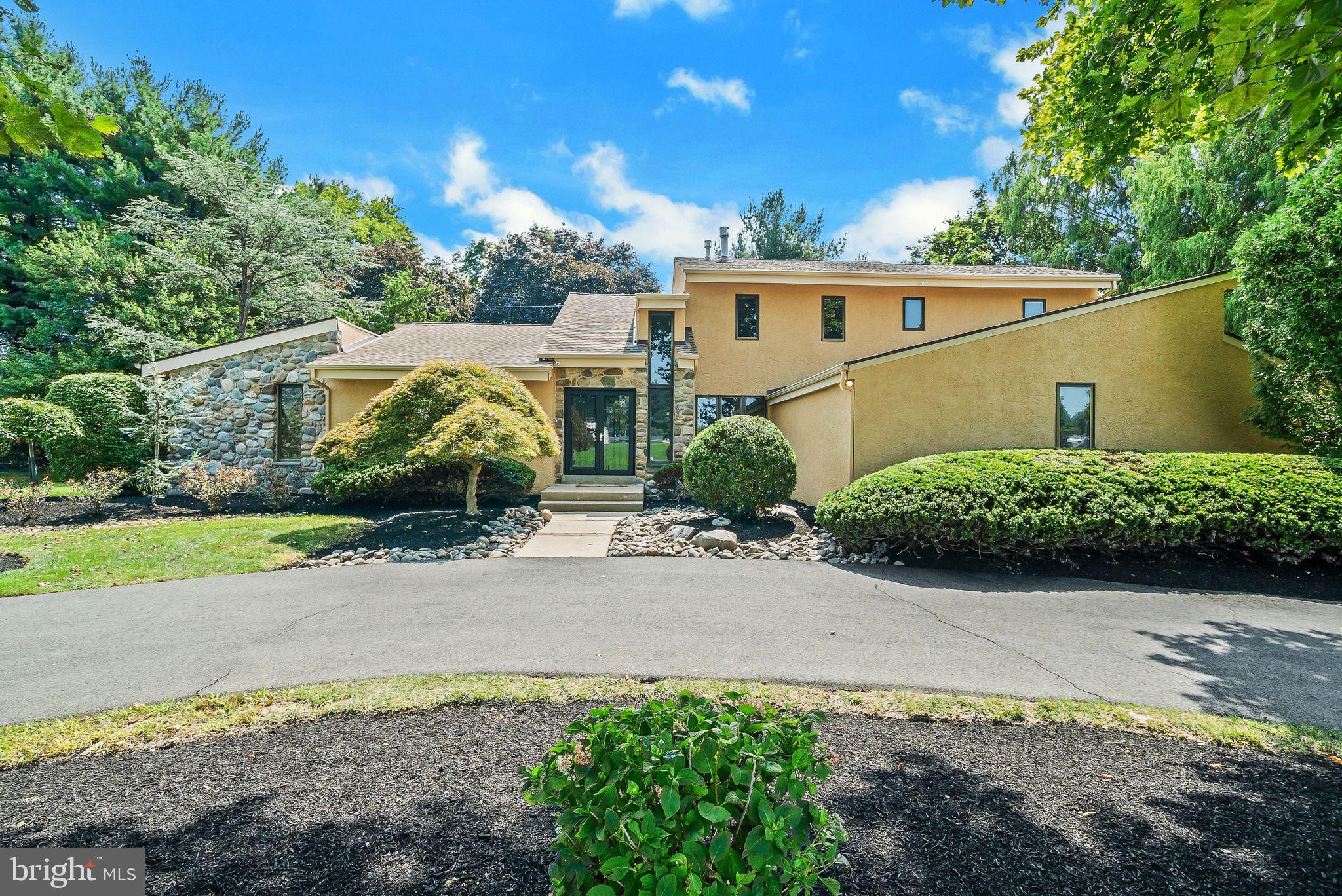 Welcome to this exceptional luxury estate nestled in one of Huntingdon Valley’s most prestigious neighborhoods within the highly acclaimed Lower Moreland School District. Extensively remodeled and thoughtfully upgraded, this stunning residence seamlessly blends timeless elegance with contemporary sophistication.

A striking stucco exterior and circular driveway create an impressive first impression, leading into a dramatic two-story foyer with soaring ceilings and abundant natural light. The elegant living room with vaulted ceilings flows effortlessly into the spacious sunken family room, creating the perfect setting for both grand entertaining and comfortable everyday living.

At the heart of the home is a beautifully redesigned gourmet kitchen featuring custom cabinetry, luxurious granite countertops, designer marble backsplash, premium stainless steel appliances, ceramic tile flooring, a large center island, and two pantry closets. The adjoining breakfast and sitting area opens directly to an exquisite paver patio, offering a seamless indoor-outdoor lifestyle ideal for entertaining or relaxing in a private setting.

The first-floor owner’s suite is a true retreat, showcasing vaulted ceilings, an expansive custom walk-in closet, and a completely remodeled spa-inspired bathroom with a freestanding soaking tub and oversized glass-enclosed shower.

An elegant open-tread staircase leads to the upper level where you’ll find three generously sized bedrooms and two beautifully renovated full bathrooms.

The finished lower level offers incredible flexibility with a media/gym/entertainment room, private office or den, and abundant storage space.

Additional highlights include:

Two-car side-entry garage with new floor coating
Large well-maintained Pella windows throughout
Two HVAC systems (newer)
Recessed lighting throughout the home
Extensive closet and storage space
Professionally landscaped grounds

Ideally located in the heart of Huntingdon Valley with convenient access to Philadelphia, Princeton, and New York via I-95, Route 1, and the Pennsylvania Turnpike. Nearby golf, tennis, and swim clubs further enhance the lifestyle this remarkable property offers.

Luxury, comfort, and location come together beautifully — make your move today.