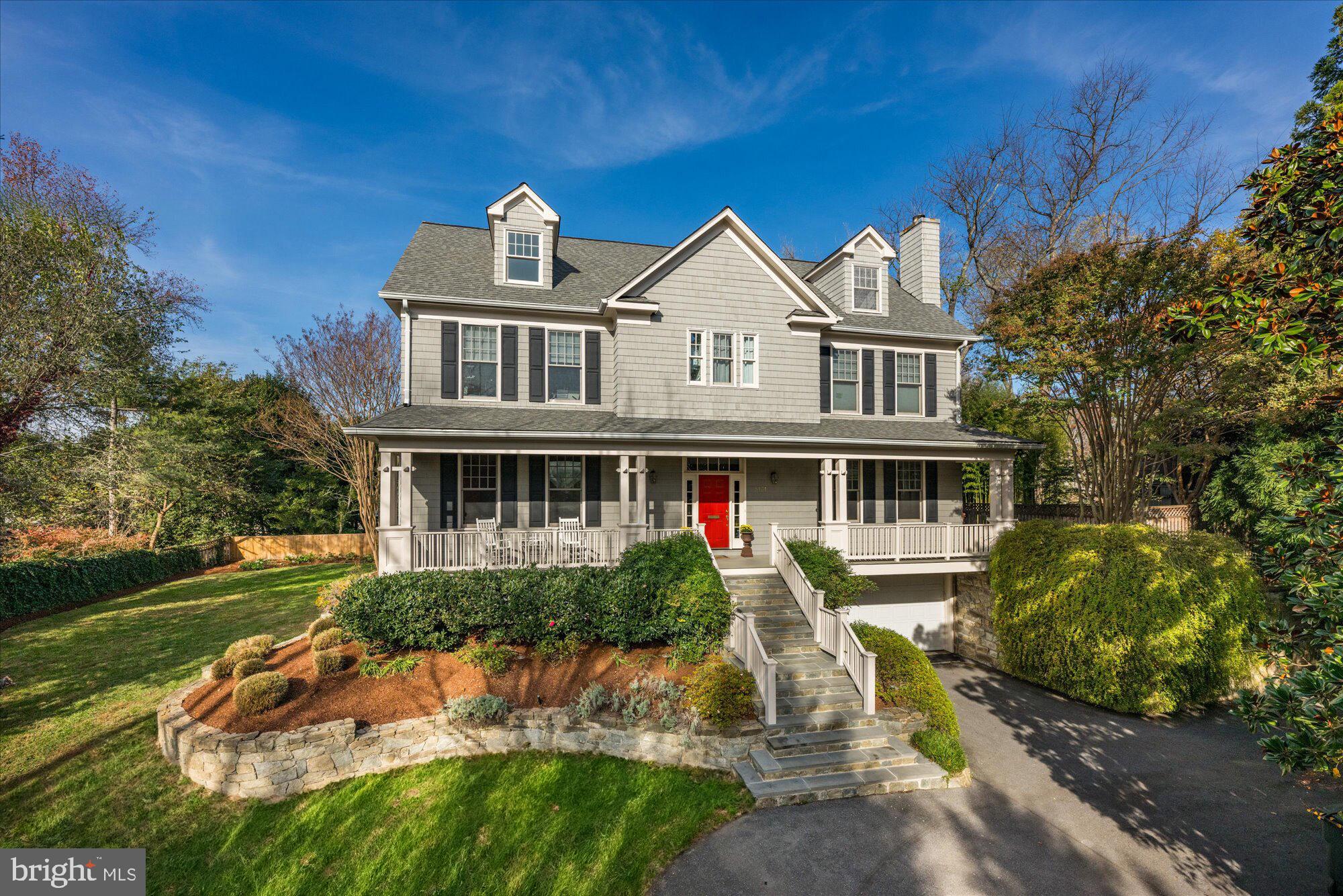 This custom home by renowned Zuckerman Brothers features four levels, six bedrooms, and five and a half bathrooms and sits on a spacious .37 acre lot. The exterior elegantly complements the large 4,800 sf floor plan with hardwood floors throughout, giving the home an ideal flow for entertaining and everyday living. The high-end oversized eat-in kitchen was redone in 2022 and boasts a center island with seating, designer stainless steel appliances, porcelain countertops, subway tile backsplash, and an informal dining area. The kitchen seamlessly flows into a coffered ceiling family room with a wood-burning fireplace, custom built-ins, and access to the expansive back patio. Completing this level is a formal dining room, formal living room with an additional wood-burning fireplace, welcoming foyer, and powder bathroom. 

The second level offers four bedrooms, including the primary bedroom with a spa-like ensuite bath featuring a walk-in shower, dual vanity, soaking tub, and generous closet space with a walk-in closet and wall of three additional closets. The conveniently located laundry room adds to the level's appeal. The third level offers a loft, the perfect home office or playroom, a bedroom, and a full bathroom. The lower level features a recreation room, additional bedroom, and full bathroom and has access to a rare attached two-car garage. The professionally landscaped exterior extends the home with a private fenced-in patio, expansive flat yard perfect for a pool, and a welcoming front porch. Located at the end of a private driveway perched at the top of a hill with dramatic views, this property offers ample off-street parking for convenience. Situated in the sought-after Kent neighborhood, this breathtaking home is within walking distance to the C & O Canal, numerous shops and restaurants, and just a short drive to all the attractions Washington, D.C. has to offer!