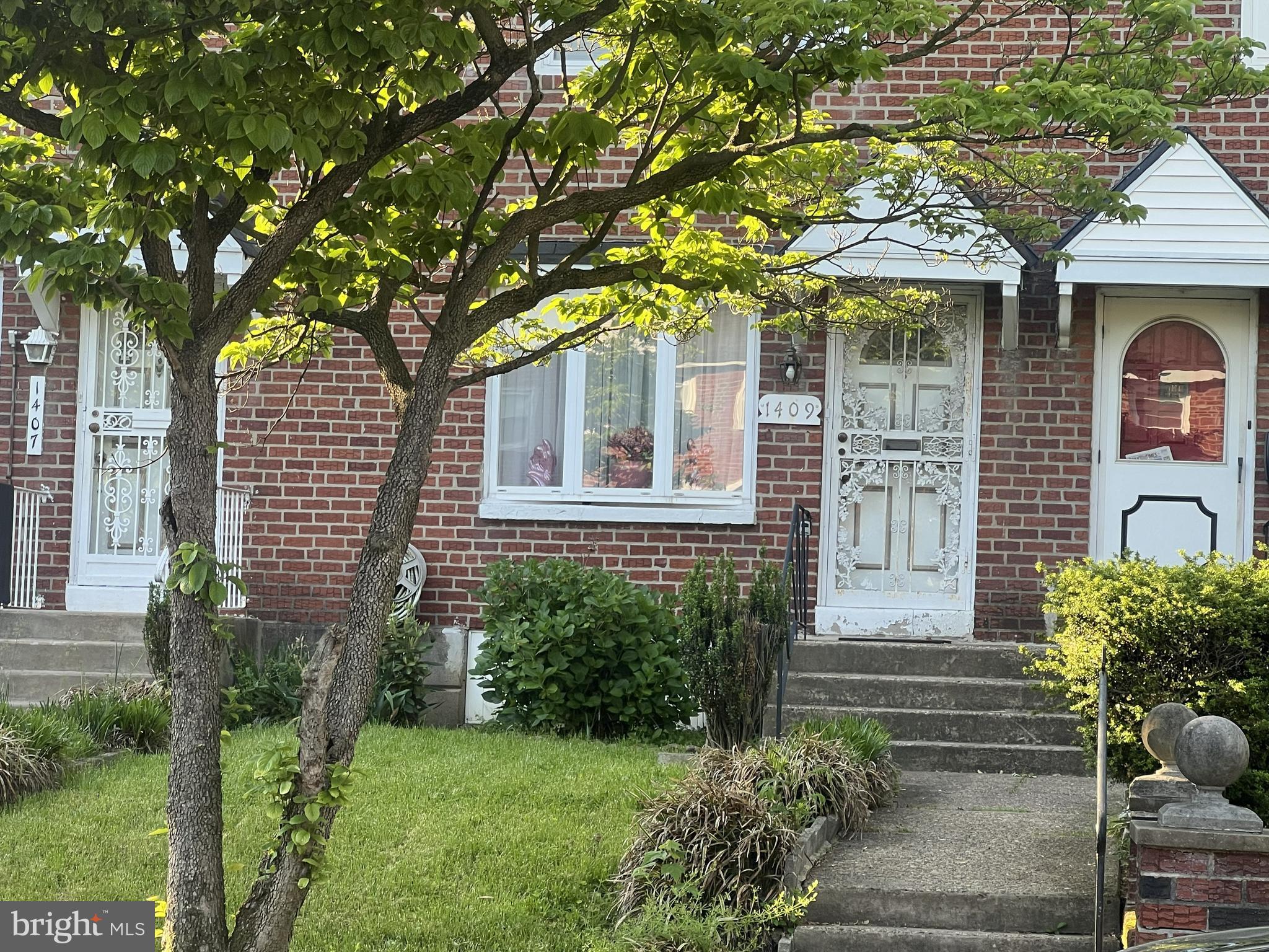 Great for a first-time homebuyer or a seasoned investor in Norris Park neighborhood.  Welcome to a 2-bedroom 1-1/2 bath brick townhouse.  It has a large main bedroom to create a more spacious 2-bedroom floor plan offering unique flexibility to either enjoy the expansive current layout of a large main bedroom and double closet space or easily convert it back to its original 3-bedroom design. On first floor, enter the formal living room through to the dining room, both are filled with natural light and charm. The enclosed rear screened porch entrance is from the kitchen area. The full finished basement with 1/2 bath adds convenience and private space for recreation and relaxation. The washer and dryer and the heating system are in a separate area.  The original hardwood floors throughout the property are a gem.  This property is being sold in "As Is" condition.  This is a great house for a homebuyer renovation loan so that they can make it to suit their own dreams.