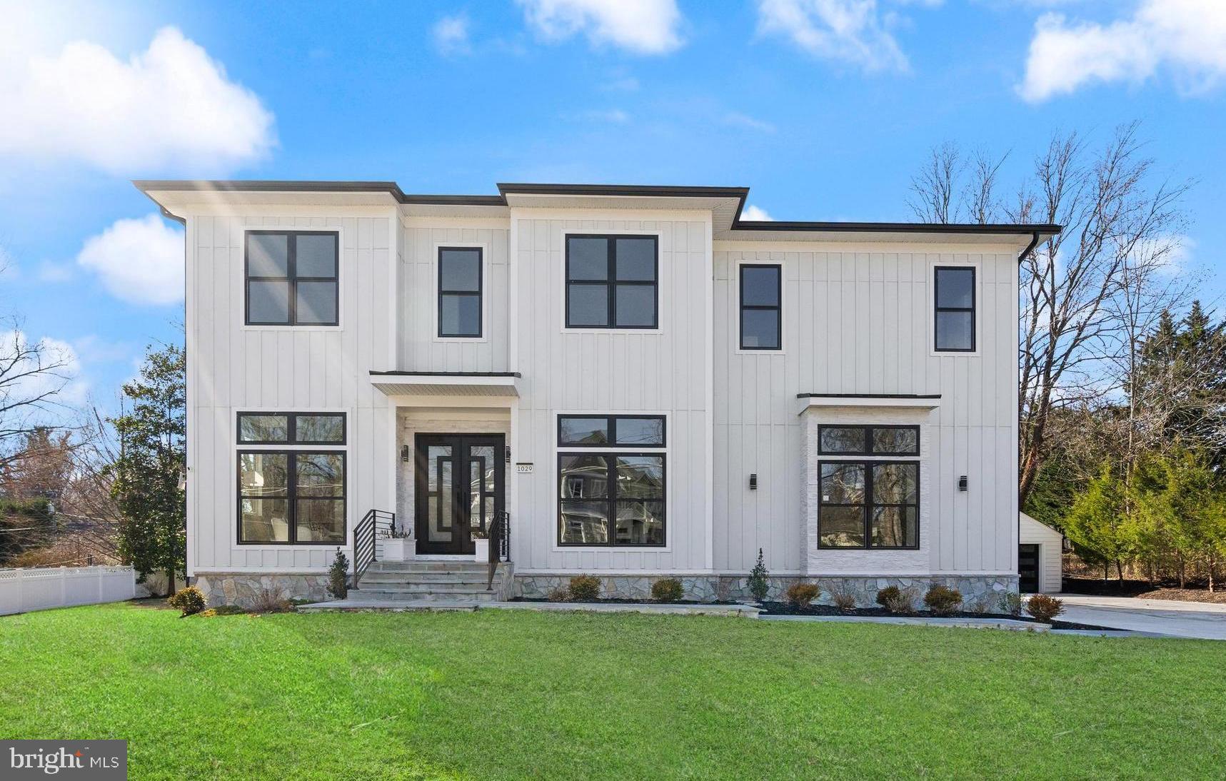 Welcome to 1029 Park Street, a beautifully crafted contemporary home in the heart of Vienna, VA. This newly built residence offers 6 bedrooms, 6.5 bathrooms, and over 5,756 square feet of thoughtfully designed living space on a generous 0.51-acre lot. Inside, 10’ ceilings and expansive Anderson windows fill the home with natural light. The main level features a chef’s kitchen with a 10’ quartz island, high-end Shiloh cabinetry, and a spacious walk-in pantry. A formal dining area, casual breakfast nook, and an inviting family room create a seamless flow for everyday living. Also on this level, a main-level bedroom with an en-suite bath, a formal sitting room or office, and a stylish powder room add to the home’s functionality. Upstairs, the primary suite boasts a spa-like bath, oversized shower, two spacious walk-in closets, and private balcony. Additional secondary bedrooms with their own en-suite baths, and a convenient laundry room, complete this level. The lower level features a private rear entrance, large recreation room with built-in cabinetry, a private bedroom with a full bath, and a versatile space for a media or game room. A rare find in Vienna, this home includes a 3-car attached garage plus a 2-car detached garage. Modern features such as a 2-zone HVAC system and two tankless water heaters enhance efficiency. Conveniently located near both the Vienna and Dunn Loring-Merrifield Metro Stations and within minutes of Whole Foods, and The Fresh Market, this home offers the best of space, style, and location. Don’t miss this incredible opportunity!
