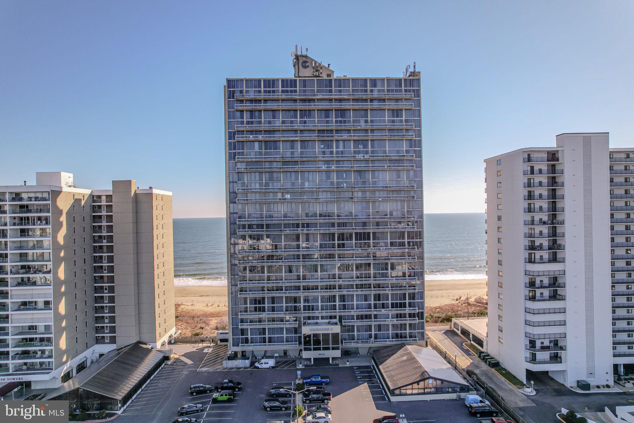 Spectacular 180-degree views of the Atlantic Ocean in this turn-key 2 Bedroom, 2 Bath, 2-story, Oceanfront Condo, with both Ocean & Bay views, that sleeps 12!  Being offered fully furnished!   Settle into this oceanfront residence or purchase this property and start earning rental income. This bright & open unit has a soothing, contemporary feel and includes all the amenities! Enter to the upper level of this condo, which hosts the primary bedroom and a full bathroom. Wake up every morning with stunning views of the ocean; it doesn’t get better than that!  Down the steps to the lower level, you will find the ideal floorplan with adjoining kitchen & living room & private balcony, with the ocean as your backdrop.   The eat-in kitchen has abundant cabinet space, center island with seating, and also plenty of space for your dining table. Completing this level is the 2nd bedroom with another private balcony and views of the Bay, another full bathroom, and the laundry.  Bonus features of this condo include abundant storage (large closets in each bedroom and in main living space), an owner’s closet (if needed), and a storage locker in the building.  Amenities included with this property include an indoor pool, fully equipped gym, expansive sundeck, sauna, outside shower, beautiful lobby, rental office (should you choose to rent your unit), high speed elevators, and parking lot.  The condo fee includes cable and all the amenities including on-site manager and security.  Do NOT let this Ocean City dream property pass you by! Be sure to view the virtual tour and schedule a showing today!