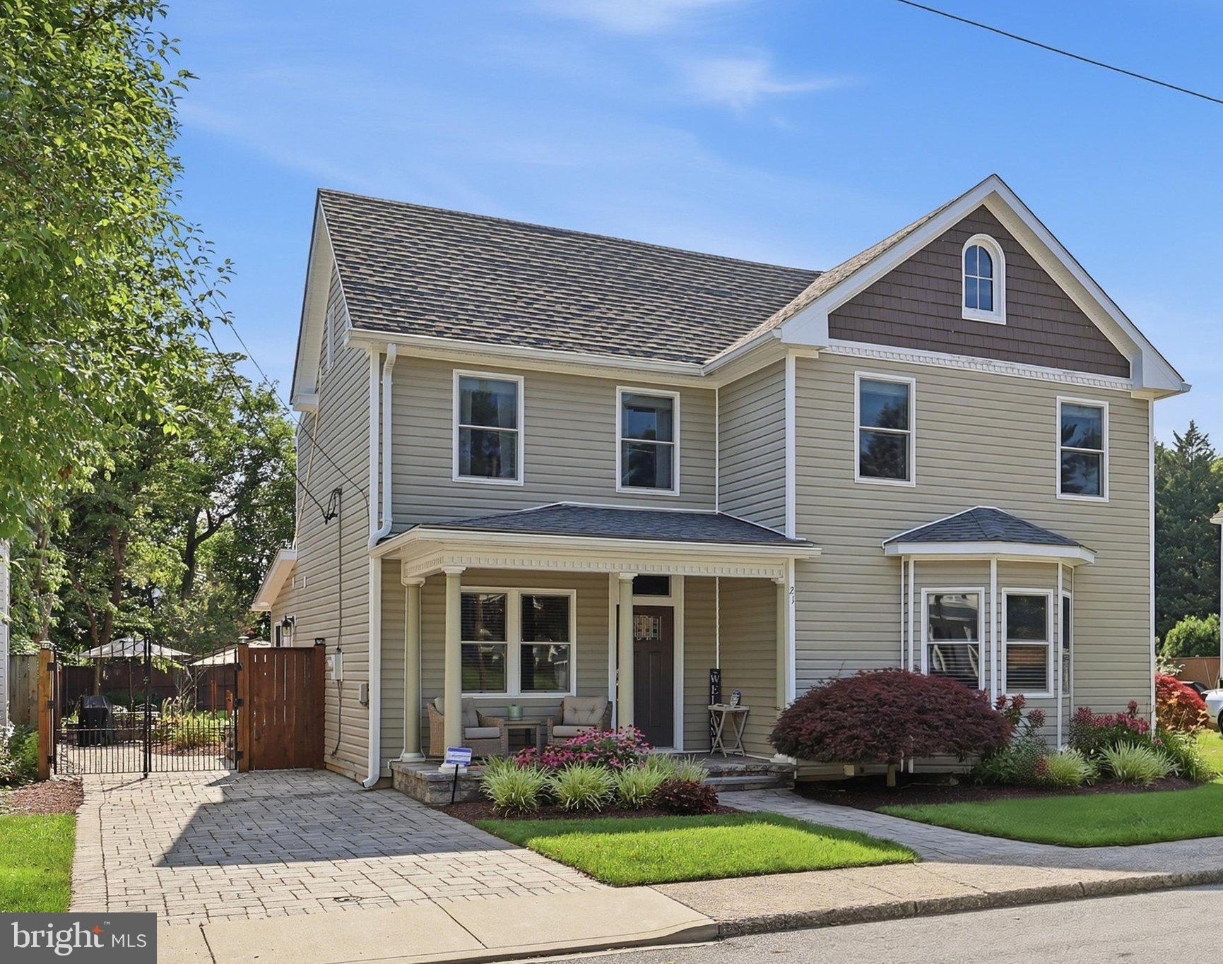 This charming Colonial home, originally built in 1925 and beautifully, fully renovated in 2015 (including plumbing, electrical, walls, floors, ceilings, roof, siding, windows, HVAC and more) offers a perfect blend of classic elegance and modern convenience. With 4 spacious bedrooms and 3 full bathrooms, this residence is designed for comfort and functionality. The open floor plan invites you to explore the inviting living spaces, featuring  hardwood floors, luxury vinyl plank, upgraded ceramic tile, custom pain throughout and recessed lighting that create a warm ambiance throughout. The gourmet kitchen is a chef's dream, equipped with a stylish island, quartz countertops, ample table space, and high-end appliances, including a wall oven, induction cooktop, dishwasher, and refrigerator. Enjoy cozy meals in the dedicated dining area or relax in the adjoining living room, complete with a charming fireplace adorned with a classic mantel. A generous sized first floor room  can be used for either a bedroom or office and includes a custom California Closet.  Natural light pours in through ENERGY STAR qualified bay windows, enhancing the home's inviting atmosphere. The large main floor laundry adds convenience to your daily routine, while built-ins provide practical storage solutions. Step outside to discover a lovely patio, perfect for morning coffee or evening relaxation including a custom awning and two large umbrellas that convey. The property features sidewalks and a driveway for easy access, along with a shed for additional storage. Set on a generous 0.21-acre lot, with tasteful mature landscaping, this home is ready for you to make it your own. With its thoughtful renovations and appealing features, this residence is not just a house; it’s a place to create lasting memories. Don’t miss the opportunity to call this beautiful property your home!