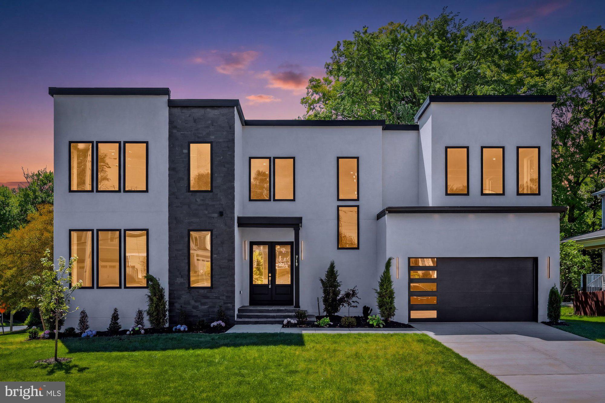 Modern luxury meets everyday convenience in this newly built 2025 custom home by Lords Meadow LLC, ideally located in the heart of Vienna with no HOA. Offering 6 bedrooms, 6.5 baths, and 6,299 square feet on a premium corner lot, this striking residence showcases bold contemporary architecture, high-end finishes, and thoughtfully designed living spaces. The main level features an open concept layout perfect for entertaining, including spacious living and dining areas, a private home office, and a main level bedroom suite ideal for guests or multi-generational living. At the heart of the home is a stunning chef’s kitchen equipped with top-of-the-line Thermador appliances, including a 48” refrigerator, 48” dual fuel range with hood, dual dishwashers, drawer microwave, granite countertops, and an impressive 10x5 waterfall island. Large Andersen windows fill the home with natural light, while two fireplaces add warmth and sophistication. Upstairs, the luxurious owner’s suite offers dual walk-in closets and a spa inspired bath with marble walls and flooring, while three additional spacious bedrooms with ensuite bathrooms, walk-in closets and an upper level laundry room provide both comfort and convenience. A versatile loft sitting area creates the perfect flex space for a lounge, study area, or secondary living room. The finished lower level is designed for recreation and entertaining with a large open space, wet bar, private gym, 6th bedroom, full bath and endless flexibility for movie nights, gatherings, or extended living. 10' ceilings on main and upper levels, 9' ceilings in the lower level. Outside, enjoy a spacious deck ideal for outdoor dining and entertaining, an oversized garage with ample storage, and a premium 0.25 acre corner lot. Just minutes from Vienna Metro, I-66, shopping, dining, and all that Vienna has to offer, this exceptional home delivers luxury living in one of Northern Virginia’s most desirable locations. Top rated Marshall Road/ Thoreau/Madison Pyramid. *Dining room, primary bedroom, living room, and lower level include virtually staged photos.