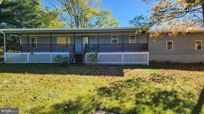 Nice Country Setting, Beautiful Mountain Views.  Very Large yard and Large 24'X40' Detached Building, as well as attached 2 car garage.  Home is placed towards rear of lot, so house sits back off of road!  Solid Masonry crawl space foundation.  So many possibilities for this property!  New Roof, and recent renovation!