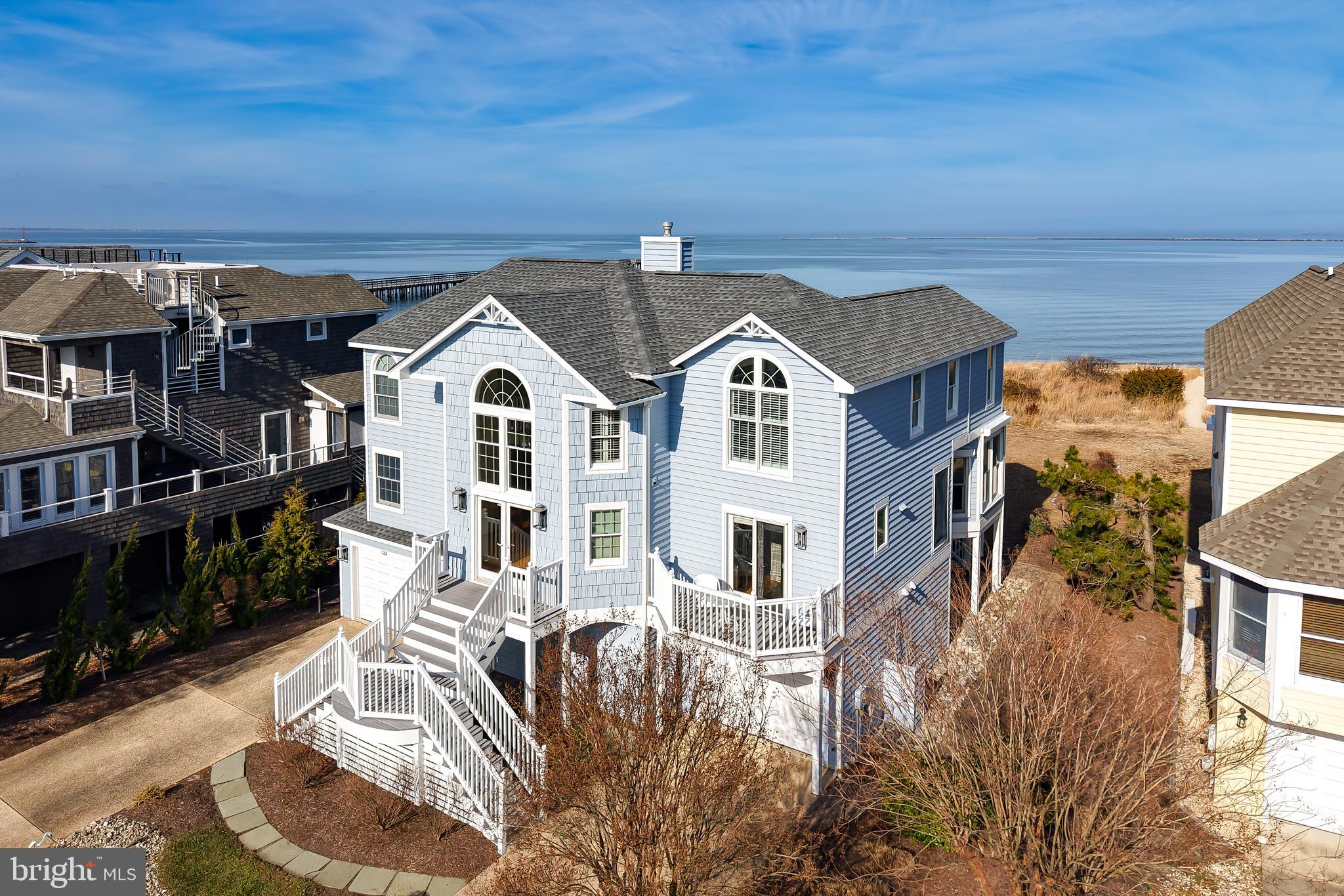 Welcome to your Front-row seat on the Delaware Bay.

At 122 Breakwater Reach, sailboats pass by, sunsets steal the show, and Cape Henlopen State Park is your backdrop—this is beachfront living at its most rare and remarkable best! 

Don’t miss the opportunity to own a premier beachfront residence in the highly sought-after Cape Shores community of Lewes Beach. Perfectly positioned on one of the largest beachfront lots in the community & overlooking the mouth of the Delaware Bay and Cape Henlopen State Park, this impressive three-level coastal home offers sweeping water & park views angled directly toward both lighthouses. and 

With 3 full floors this home is thoughtfully designed for both relaxed coastal living, entertaining and multi generational families. Open, light-filled living spaces flow seamlessly to multiple decks, balconies, and a spacious beach side yard—each capturing the ever-changing beauty of the bay.

The first level features a generous family room, ideal for gathering after a day at the beach. The main living level is bathed in natural light and showcases a stunning sunroom with panoramic water views, as well as an office and den—perfect for working remotely or unwinding in comfort. The top floor is dedicated to rest and retreat, offering a private primary suite with spectacular bay views and three additional bedrooms.

Cape Shores is an amenity-rich, private community featuring uncrowded beaches, swimming pool, clubhouse, tennis courts, fishing pier, kayak & paddle board storage  and direct access to Cape Henlopen State Park. Enjoy miles of scenic biking and walking trails, along with easy access to historic Lewes and the vibrant beach town of Rehoboth. And don’t forget you won’t have to leave home for the iconic Lewes July 4th fireworks display !