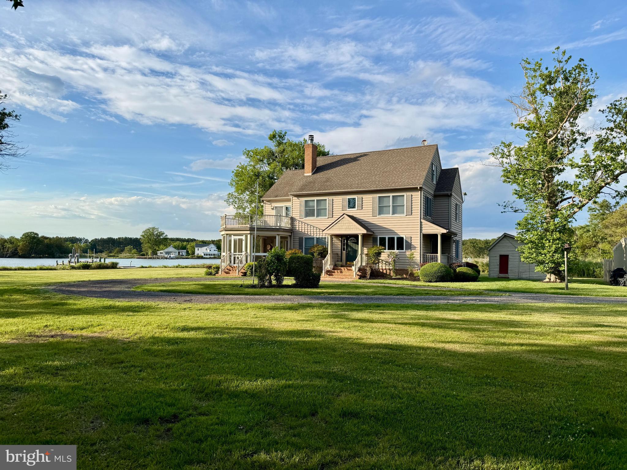 Coming May 8 , this exceptional waterfront estate in Dorchester County offers sweeping panoramic views of Church Creek with direct access to the Chesapeake Bay . Also located in the highly sought after Cambridge South Dorchester School District . Featuring over 470 feet of protected shoreline , a private dock with 4 feet of water depth, and a boat lift , this property is a rare opportunity for true waterfront living . The 3400 square foot , two and  a half story home is thoughtfully designed to capture stunning water views from every angle . In side you will find four spacious bedrooms , including a grand primary suite , along with two full baths and a half bath on the upper level. The main floor is ideal for both everyday living and entertaining . offering a large waterfront dining room , a cozy water view den , and an expansive living room with a wood burning fireplace . The modern kitchen is beautifully updated and includes a pantry and a covered side porch. A unique extended screened porch off the dining room provides the perfect setting to relax and take in the serene views of Church Creek. Upstairs, the luxurious master suite features walk in closets, and the master bathroom showcases a vintage inspired clawfoot tub , a standout feature for those drawn to a modern farmhouse aesthetic , along side a walk in shower. Step out onto your private deck from the master bedroom to enjoy breathtaking sunsets over the water. Two additional bedrooms share a well appointed bathroom , spacious laundry room includes a new washer and dryer . The third floor offers flexible space with two large rooms , ideal for additional bedrooms , a home office , office gym, or media room . Additional features include multiple outbuildings : a two car garage, a kennel with three bays ready for future fencing , and a separate structure perfect for storage of a office. The property spans three lots totaling 3.395 acres of land , accessed by a long privately owned driveway that ensures ultimate privacy . This truly remarkable waterfront retreat where privacy, natural beauty, and expansive water views come together , an opportunity that must be experienced to  be fully appreciated