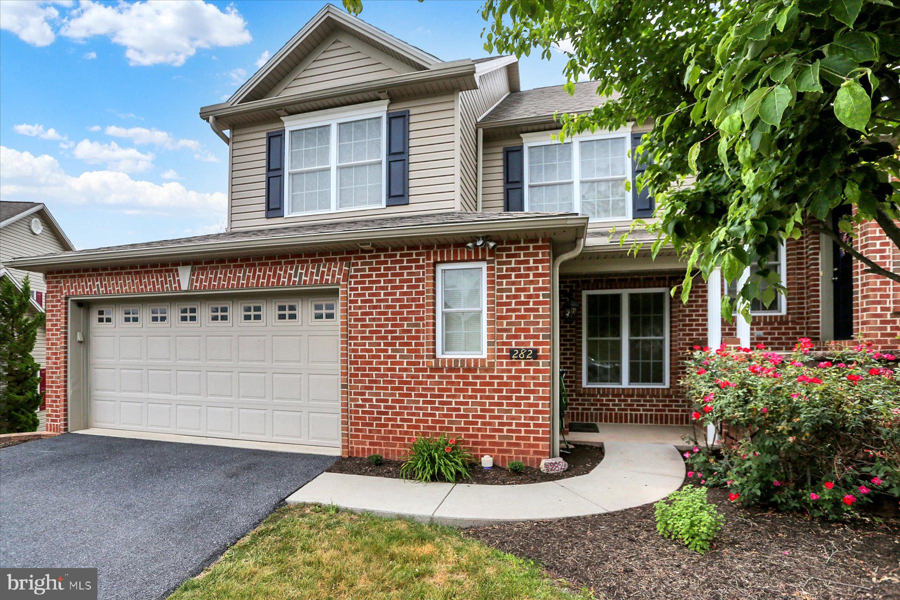 Welcome to easy living in one of New Cumberland's most sought-after neighborhoods! This beautiful brick-front, end-unit townhome in Olde Orchard Hill offers the perfect blend of comfort, space and convenience with a thoughtfully designed floor plan that truly stands out. Step inside to discover brand-new luxury vinyl plank flooring throughout the entire first floor, creating a fresh, cohesive look from the moment you enter. The entry foyer features generous closet space, which includes a custom pantry, and a half bath with a pedestal sink and pocket door, before leading into the dining area—the perfect gathering space for everyday meals or entertaining. Just beyond, the bright kitchen offers abundant cabinetry, all appliances (including a trash compactor!) and a touch of retro charm that gives the space its own personality. Open to the dramatic, vaulted living room, you'll love the gas fireplace, oversized skylight with motorized shade and soaring ceiling overlooked by the second-floor loft. Rear door leads to the enclosed screened porch with low-maintenance composite decking, offering a peaceful and private retreat to enjoy your morning coffee or unwind at the end of the day. Intentionally located on the main level, the spacious primary bedroom suite features vaulted ceilings, a walk-in closet and private full bath with a convenient laundry closet—front-loading washer and dryer included. Also on the main level, a spacious 2-car garage provides easy everyday access along with plenty of room for parking, a utility sink and additional built-in cabinets for storage. Upstairs, the loft overlooks the living room below and offers flexible space for a home office, reading nook or hobby area, along with two additional bedrooms, a full bath and generous walk-in closet space. The walk-out basement provides abundant storage, a workshop area and endless potential to finish additional living space, with direct access to the covered hardscape patio for even more outdoor enjoyment. Built using the desirable Olde Orchard II floor plan, this home is 2 feet wider than many others in the community, offering noticeably more elbow room along with several custom features. Natural gas heat, central air, a sprinkler system, public utilities, and a low HOA fee of just $110 per month—covering lawn care and snow removal—make this home as practical as it is inviting. Finally, a 1 year First American Eagle Premier home warranty is included, for peace of mind coverage on all mechanicals, including the add-on coverage for the refrigerator, washer and dryer! Conveniently located in the West Shore School District, you'll enjoy easy access to shopping, restaurants, medical facilities and major highways. If you've been looking for a spacious townhome with a first-floor primary suite in a location that's always in demand, this one is ready to welcome you home.