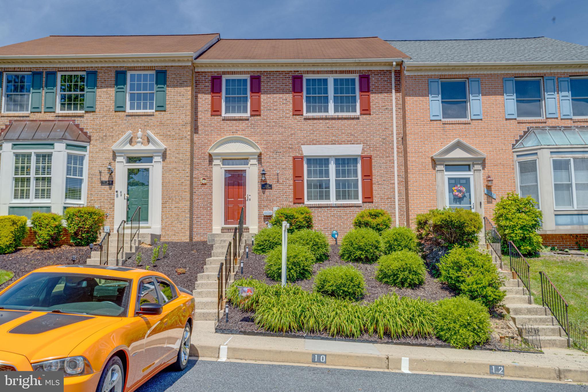Welcome to this gorgeous, over-sized 4 bedroom, 3 1/2 bath brick front townhome located in the Bel Air neighborhood of Foxborough Farms.  This home is located just minutes outside of downtown Bel Air, and for the commuters it is just a straight shot down Rt 543 to reach I-95.  Taking the steps up to the front door brings you to a small tiled foyer with a coat closet to the left.  Ahead of you hardwood flooring leads down a hallway to a convent first floor powder room and then the eat in kitchen.  To the right is a large carpeted living room that then opens up into a formal dining room area.  The formal dining area then circles back into the large kitchen.  The kitchen has tons of cabinetry, an island, a backsplash and all stainless steel appliances.  There is also room in here for a casual dining table.  Sliders off of the casual dining area lead out onto the rear wood deck.  The deck overlooks and has stairs that walk down to the landscaped backyard and privacy trees beyond.  The rear yard had been beautifully landscaped and converted into one big garden with a pond at the center.  There is also a paver walkway to lead to the rear of the property. 
Back inside, taking the stairs up to the second floor brings you to a fully carpeted second floor.  Up here you'll find a full bath off of the main hallway with a tub/shower combo.  You'll also find three bedrooms on this floor including the oversized owners suite.  The owners suite has double closets and its own en suite bathroom.  This bathroom has a vanity area, soaking tub and walk in shower.
Heading down to the basement brings you to a level covered in LVP flooring.   A short hallway takes you back to another large living room area with a pellet stove and a small wet bar in the corner.  Sliders off of this room lead out to a second deck below the main deck.  This is the perfect area for relaxing in the shade.  Back inside the basement you'll also find a carpeted fourth bedroom with its own walk in closet as well as a full bath with a walk in shower.  Lastly there is a walk in laundry room down here and access to mechanicals.  This house is a true gem and has been well taken care of.  It is move in ready and waiting for you to come see it today.
