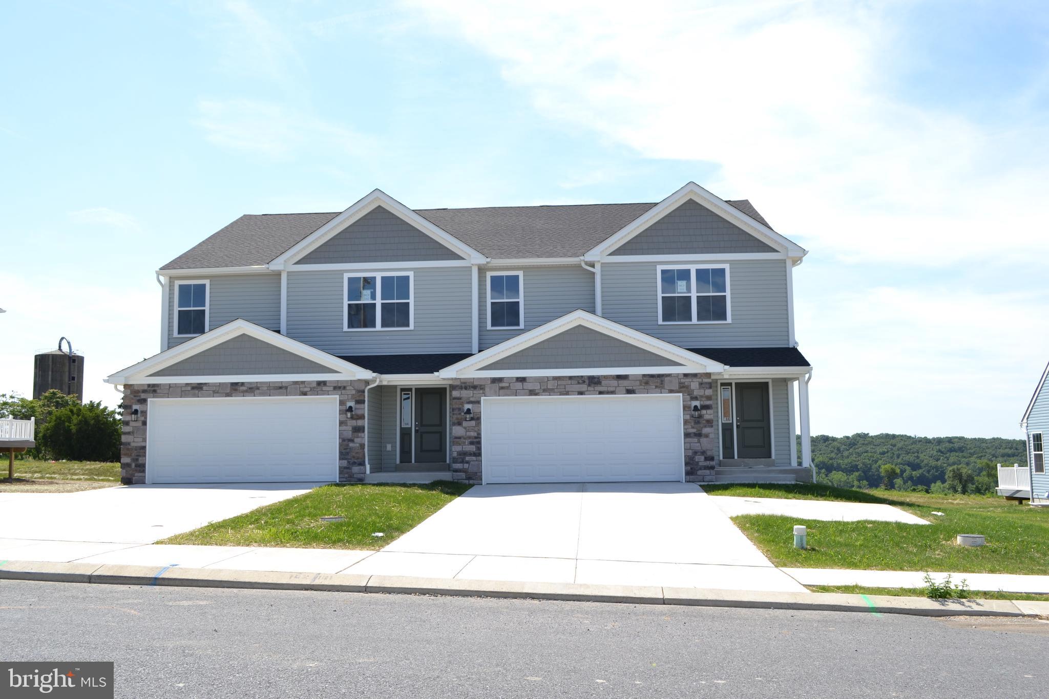 Back on the market—and your second chance won't last. A buyer's change of plans means this completed, move-in ready Chestnut is available once again. Better yet, it's the final new construction home in McIntosh Farms II—beautifully situated at the top of Ida Red Drive, where you'll enjoy peaceful surroundings and sweeping views. Inside, you'll find a bright, open layout. An oversized foyer welcomes you into a spacious great room that flows into the kitchen and dining area, creating an ideal space. Luxury vinyl plank flooring extends throughout the entire first floor, while a sliding glass door opens to the rear deck. The kitchen combines timeless style with everyday function, featuring white maple cabinetry, granite countertops, a tile backsplash, stainless steel appliances, abundant recessed lighting, and plenty of storage—including a separate pantry. The first floor also includes a convenient laundry room with additional cabinetry and a powder room. Upstairs, upgraded luxury vinyl plank flooring continues on the staircase and spacious landing. The primary suite offers a generous walk-in closet and an en-suite bath with a double vanity. Three additional bedrooms provide large closets, while a full hall bath and linen closet complete the second floor. This home is 100% complete and available for immediate settlement, so you can skip the wait and start enjoying your new home right away. The last new home in one of the best locations in the neighborhood. Ready today!