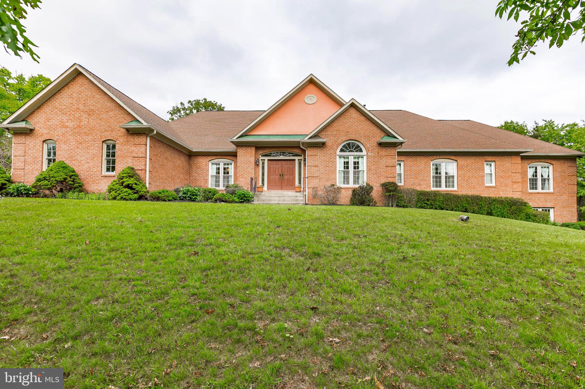 Situated on a prime corner 2-acre lot in the Palatine community, this custom sun-filled home offers space, elegance, and timeless design. Lovingly maintained by its original owners, it features 6 bedrooms, 4 full baths, 2 half baths, and a rare 5-car garage.

The main level boasts hardwood floors, arched hallways, vaulted and tray ceilings, and abundant natural light from skylights. Formal living and dining rooms are ideal for entertaining, while the family room features a striking stone fireplace. The primary suite offers deck access and serene views.

Also on the main level: 3 additional bedrooms, 2 full baths, 2 half baths, a private den/office, and an eat-in kitchen opening to an enclosed screened porch.

The finished walkout lower level includes multiple recreation areas, a wet bar, 3 bedrooms, and 2 full baths—perfect for guests or multi-generational living.

Updates include a 1-year-old water heater, and a roof approx. 6 years old. Estate sale, sold strictly as-is.
