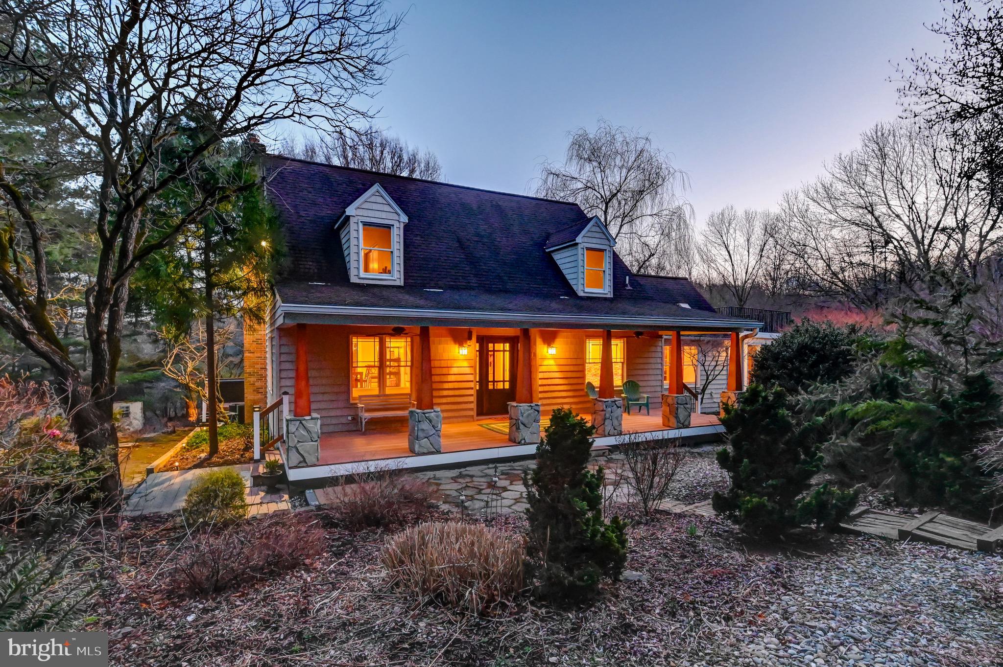A peaceful, storybook setting tucked away on 7+ acres in the Hereford Zone. A place where you can actually slow down and enjoy where you are. A picturesque front porch with stone pillars, ideal for morning coffee or unwinding at the end of the day. Light-filled spaces throughout, with an open flow from kitchen to dining to living that feels easy and comfortable from the moment you walk in. Main level primary suite with a glass-enclosed sitting room that feels like a quiet escape. A lifestyle property that feels like being on vacation every day.