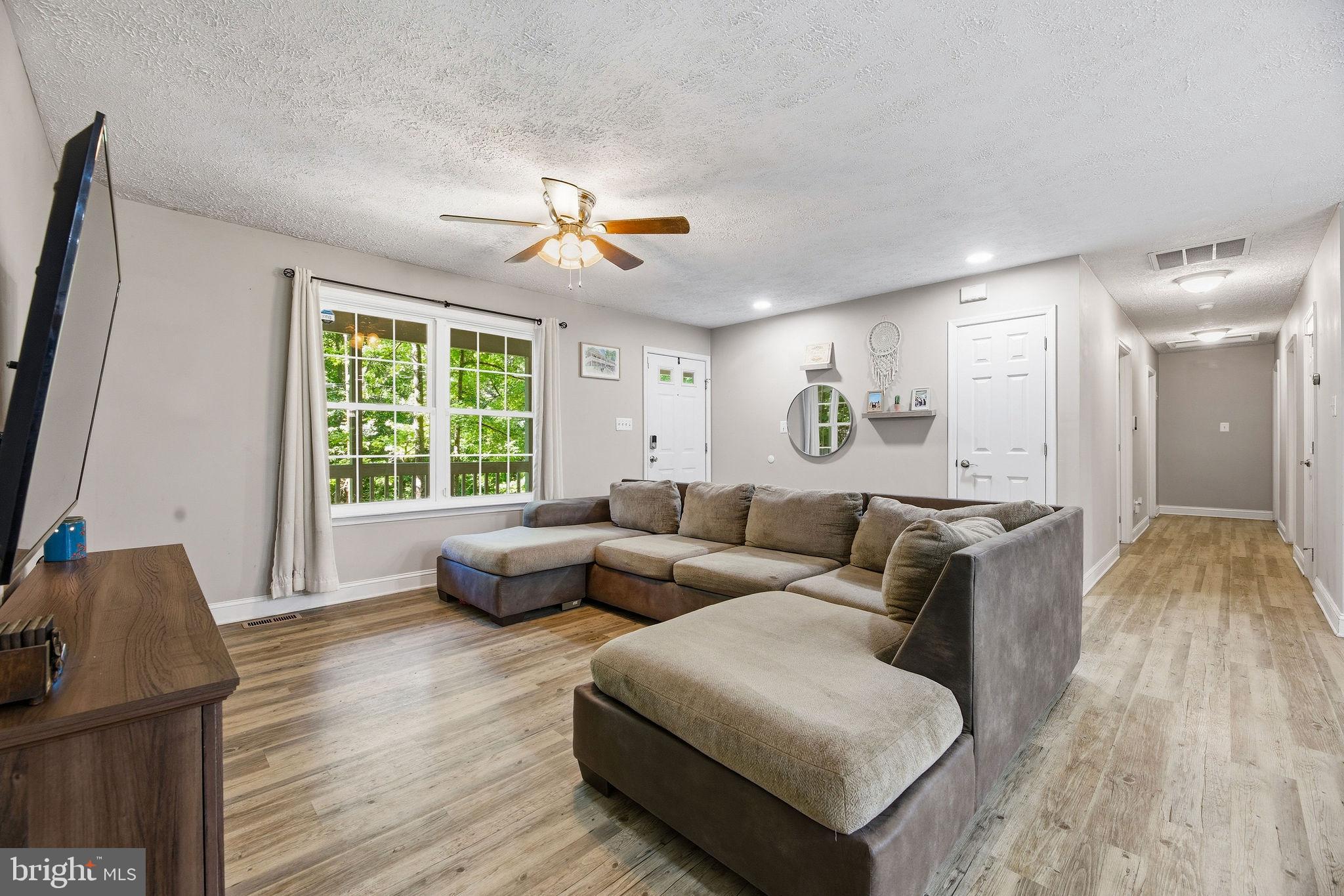 Open House Sunday, July 5th from 12pm-2pm!!!
Welcome to 12418 Red Rock Ct in Lusby! This 3 bedroom, 3 FULL bathroom home offers easy one-level living with an open floor plan that makes the main living areas feel connected and functional. The kitchen opens nicely into the dining and living spaces, giving you a comfortable layout for everyday living, hosting, or just keeping things simple.

Situated on a corner lot, the home also offers great outdoor space with a large covered front porch, fenced-in back yard, and two sheds for extra storage. Whether you want room for pets, play, gardening, or a place to relax outside, this yard gives you options.

Located in Chesapeake Ranch Estates, you’ll have access to community amenities including Lake Lariat, private beaches, playgrounds, basketball courts, community center, and more. You’re also close to Driftwood Beach and Seahorse Beach, giving you that Southern Maryland lifestyle with beaches, water access, and community amenities right nearby. The location is also convenient to Solomons, Prince Frederick, and PAX River Naval Base, making it a great option for those looking to enjoy the amenities of CRE while still being close to shopping, restaurants, commuter routes, and local employment centers.