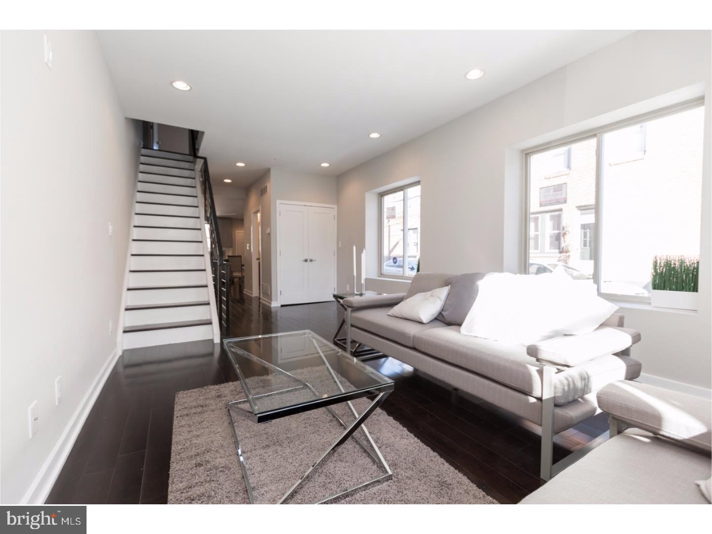 The Somers Team welcomes you to the new corner of Salmon and Albert Streets...This home has been passionately and meticulously restored by the EMES Design & Development team and includes the addition of a full 3rd story master suite, Roof deck stretching the home's full footprint, and a full finished basement. Did we mention the 10-year tax abatement?! This home boasts a new contemporary/modern design and features over 2,500 sqft of fabulousness, including 3 bedrooms, a large den space (3rd Flr) , 2.5 bathrooms, 9+ foot ceilings, a custom Chef's kitchen, dual-zone high-efficiency HVAC, hardwood flooring, and recessed LED lighting throughout. There's even a rear yard! The first floor features the living/dining area, custom model kitchen equipped with energy-efficient stainless steel matching series appliances, rear yard access, storage, and a first-floor powder room. The second floor features 2 large bedrooms each with lighted closets and share a full bathroom with a custom tiled bath/shower combo. The third floor features the master bedroom suite, designed with effusive natural light throughout! This floor is complete with a front-facing den, a large walk-in closet, oversized windows with views of the Center City skyline, and a master bath equipped with a dual vanity and a glass-enclosed shower with more custom tile work... Walk into the suites Den space and take the stairs up to your roof deck pilot house to sit under the stars or just relax and enjoy a day under the sun on this full sized roofdeck. This space also has unobstructed views of the center city skyline, Delaware river and the Ben Franklin bridge! Conveniently located and within walking distance to all that Fishtown has to offer, including public transportation, shopping, most area bridges, parks, and the entrance to i95. Center City is just minutes away. Home is also within walking distance to Stocks Bakery, Green Rock Tavern, the Hinge Cafe, Tacconelli's, Bait & Switch, and Kitty's Luncheonette. This home is outstanding and we hope you visit soon! New construction in the area can exceed 400k - 450k, so this property will not last long. Includes 1 Year builders warranty.