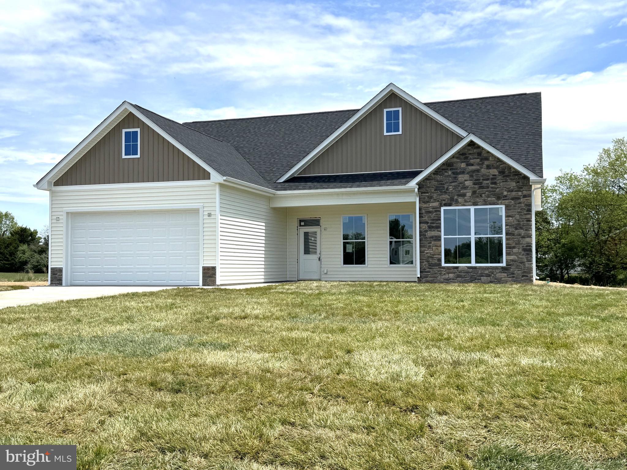 Almost complete on 1 acre Lot  Just over 1700 sqft rancher offering open floor plan with vaulted ceilings in main living areas, impressive 10ft ceilings in bedrooms, and tray ceiling in Primary Bedroom with recessed lights. The Primary Bath features large dual head tile shower . Kitchen is upgraded with large center island, quartz countertops, Stainless steel appliances, and upgraded cabinetry including pantry. The 14x16 sunroom has vaulted ceilings and gas fireplace and opens to rear concrete patio. Front porch, stone on front of home, 2-car garage, and paved driveway included.  Builder offers $10,000 towards closing assistance.  30 days to completion!