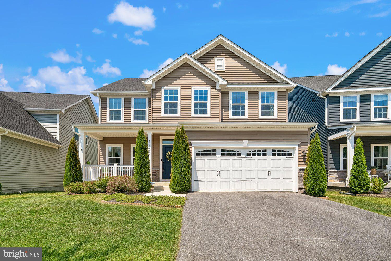 Wooded privacy and modern luxury combine in this immaculate 5-year-young home with 5 bedrooms and 4.5 baths, and located in the premier all ages section of popular Two Rivers backing to mature trees with peaceful wooded views.  The main level boasts attractive LVP flooring and neutral carpeting, a private room for the perfect office or main level bedroom, and a stunning gourmet kitchen featuring an oversized island with gleaming white Quartz countertops, espresso cabinetry, and chic subway tile backsplash. Entertain effortlessly in the open-concept family room with a cozy gas fireplace, or transition to the amazing outdoor spaces including the covered composite deck, the full fenced backyard, or the expansive hardscape patio, all with tranquil wooded views.  The upper-level owner’s suite is a true retreat with a tray ceiling, massive walk-in closet, and a spa-like bath with double Quartz vanity, soaking tub, and separate shower with custom tilework.  Three additional bedrooms of generous size are also found on the upper level, along with two additional upgraded full baths, and a convenient upstairs laundry room.  The finished lower level provides an ideal space for guests with a true 5th bedroom with full sized egress window and a 4th full bath.  A spacious rec room with recessed lighting and walk out slider to the private backyard and a storage area completes the lower level. This turnkey home is ready for you, along with the unparalleled amenities of Two Rivers (outdoor pool, tennis / pickleball courts, walking paths, biking trails, dog park, playground, basketball courts, volleyball courts, and clubhouse)!