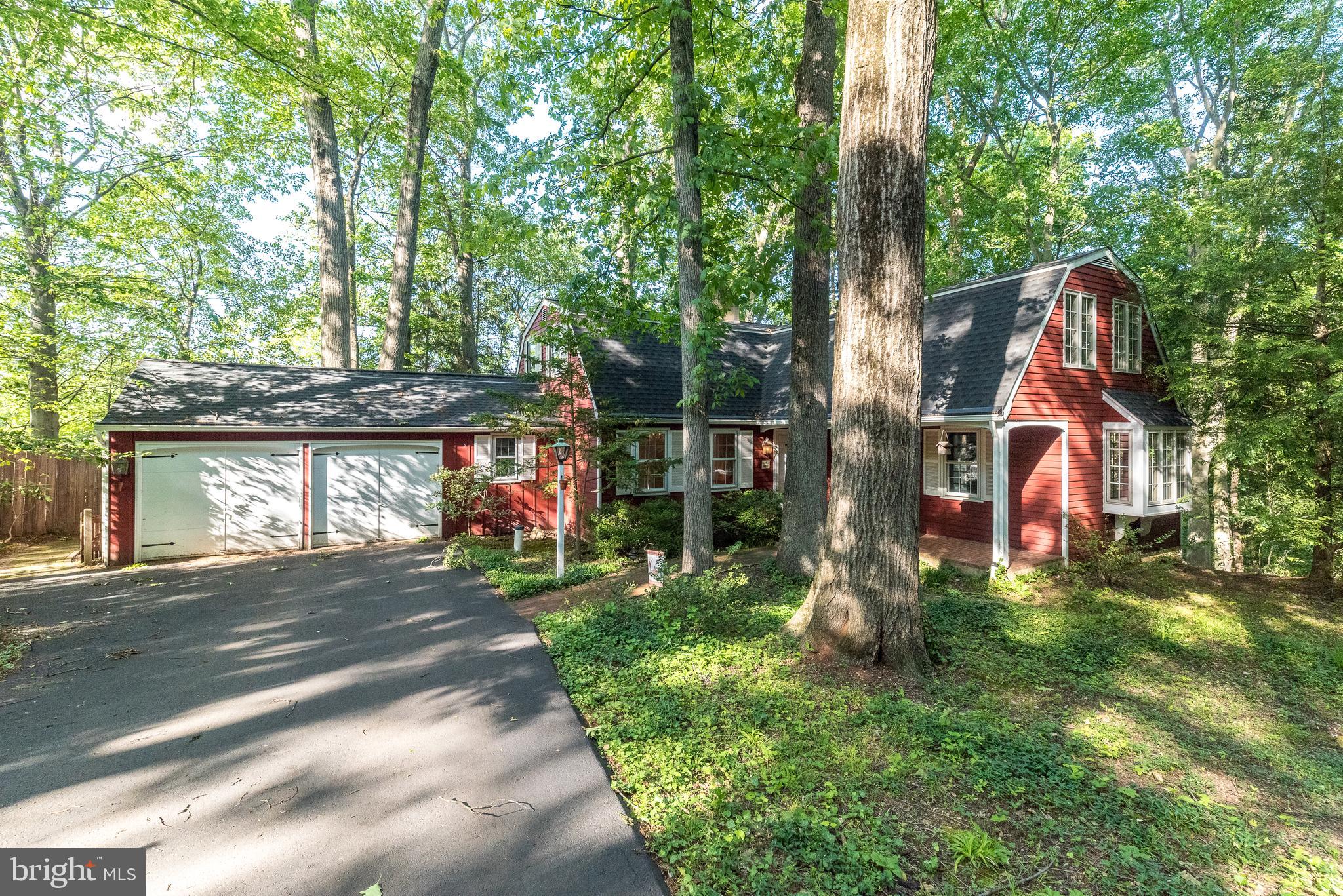 Open House Sunday, May 31 from 12 to 2.
This charming home, nestled on nearly a half-wooded acre in Doylestown, offers the perfect blend of warmth, character, and thoughtful updates. Superior improvements include a newer roof,  a beautifully remodeled kitchen featuring soapstone countertops, hardwood floors, French doors, main floor laundry, a partially finished basement, and a no-maintenance deck overlooking  wooded views.

The inviting Living room is highlighted by hardwood floors, a cozy wood-burning fireplace, and French doors leading to a versatile library/bonus room — ideal for a private home office, music room, or reading retreat.

Upstairs, the spacious primary suite offers three closets, its own full bath, and an adjoining sitting room or flex space, creating a peaceful private retreat. Two additional bedrooms and a second full bath complete the upper level.

The partially finished walk-out basement offers abundant storage, hobby and workshop areas, along with a charming garden room featuring an additional fireplace — perfect for creative space, entertaining, or relaxing year-round.

Outdoor living is equally appealing with the expansive no-maintenance deck, ideal for grilling, entertaining, or simply enjoying the beauty and tranquility of the wooded setting.

Additional highlights include a two-car garage with a 240-volt, 16-amp electric vehicle charging station located in front of the garage. For added peace of mind, the property also includes a 7,500-watt portable gasoline generator with external house connection and cut-overs wired to six circuits, including the refrigerator, heater, and well, along with a snow blower being conveyed in as-is condition.

Located in highly desirable Doylestown, this home enjoys close proximity to parks, historic sites, shopping, dining, and convenient access to New Jersey, Philadelphia, and Montgomery County.