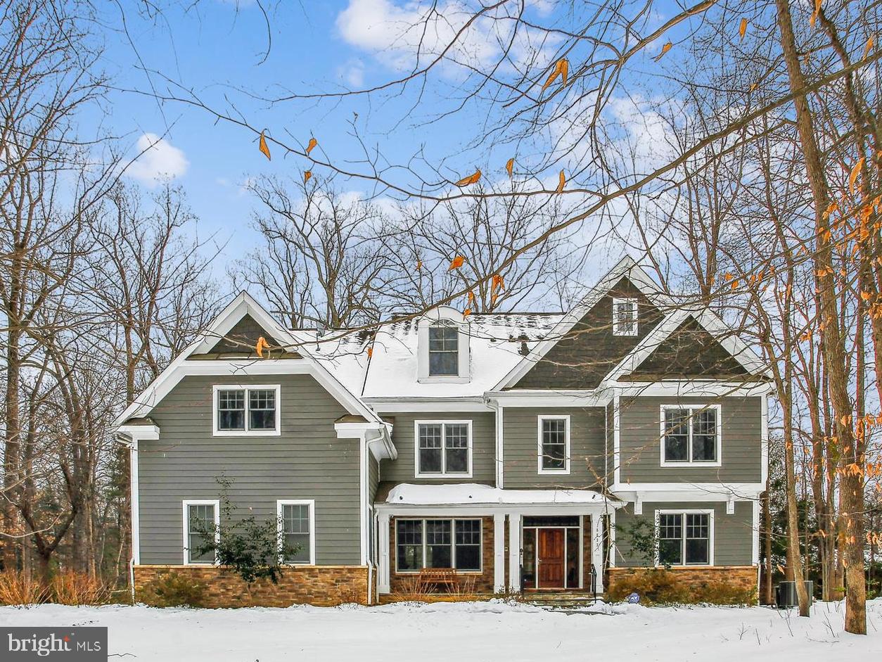 Discover luxury and elegance in this stunning 6-bedroom, 5.5 bathroom home that truly has it all. Nestled on a private, nearly one-acre lot within the sought-after Van Winkle community in Falls Church, this residence is surrounded by custom-built homes on an idyllic circular street. Built less than 20 years ago, the property has been lovingly maintained and thoughtfully updated to blend modern comfort with timeless charm.
Exceptional Features You'll Love:
    Primary Bedroom Suite: A spacious retreat featuring two custom walk-in closets, a cozy gas fireplace, a beverage station, a tray ceiling with ambient lighting, and a spa-like bathroom with a jetted tub, a walk-in shower with jets, dual vanities, and vaulted ceilings.
    Chef’s Kitchen: Oversized island with white quartz countertops, a fabulous herringbone tile backsplash, paneled appliances, a Wolf gas cooktop, double ovens, two Bosch dishwashers, and abundant pantry storage. This space seamlessly flows into the family room and breakfast area, making it perfect for entertaining.
    First-Floor Flexibility: Dedicated office with gas fireplace, wainscoting, and built-ins; it could serve as an additional bedroom if needed.
    Luxurious Living Spaces: Gorgeous refreshed hardwood floors, 10-ft ceilings, and a family room with coffered ceilings, built-in cabinets and shelves and a gas fireplace.
    Entertainment-Ready: A fully finished lower level with a home theater, a wine cellar, and a built-in bar equipped with a mini fridge.
    Additional Bedrooms: A junior primary suite with en-suite bath and walk-in closet, two bedrooms with jack and jill bath on 2nd level plus two top-floor bedrooms/playrooms with dormered windows and a full bath.
Outdoor Serenity:
Step outside to unwind in your private oasis. The screened-in porch with Trex flooring, vaulted ceilings, skylights, and a ceiling fan lead into  a large deck with steps to stone patio and fenced backyard. The nearly one-acre lot features mature trees, raised bed gardens, and a charming shed, offering tranquility and outdoor recreation possibilities.
Practical Perks
    Whole-house generator for peace of mind.
    Large windows throughout, filling the home with natural light.
    Oversized 3-car garage with direct access to the main level and an EV charging station.
    Updated mechanical systems, including new dual-zone HVAC on upper floors, central vacuum, surround sound, and exterior lighting.
With approximately 7,750 square feet of meticulously designed living space, this home blends elegance, functionality, and modern convenience. Its prime location inside the Beltway, coupled with its beautifully landscaped grounds and warm community setting, makes it truly one of a kind.