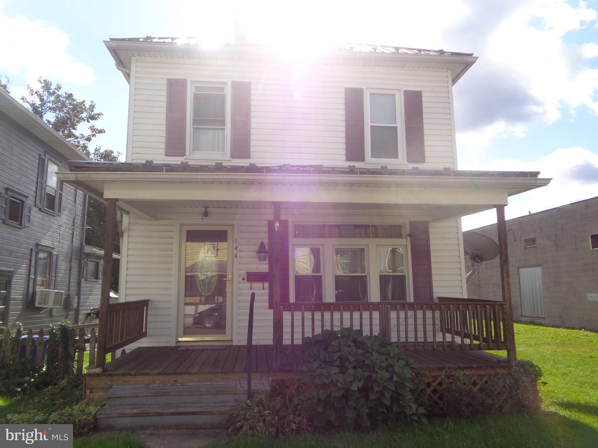 Quaint 2 story, features  3 bedrooms, 2 full baths (one with stackable laundry), formal dining room with built-in corner hutches & hardwood flooring, economical gas heat & gas hot water heater plus 4 mini splits for auxiliary  heat & cooling.  Newer metal roof, updated kitchen  & vinyl replacement windows, covered porches front and back.  10' x 16' storage shed, fenced rear yard and off street parking.