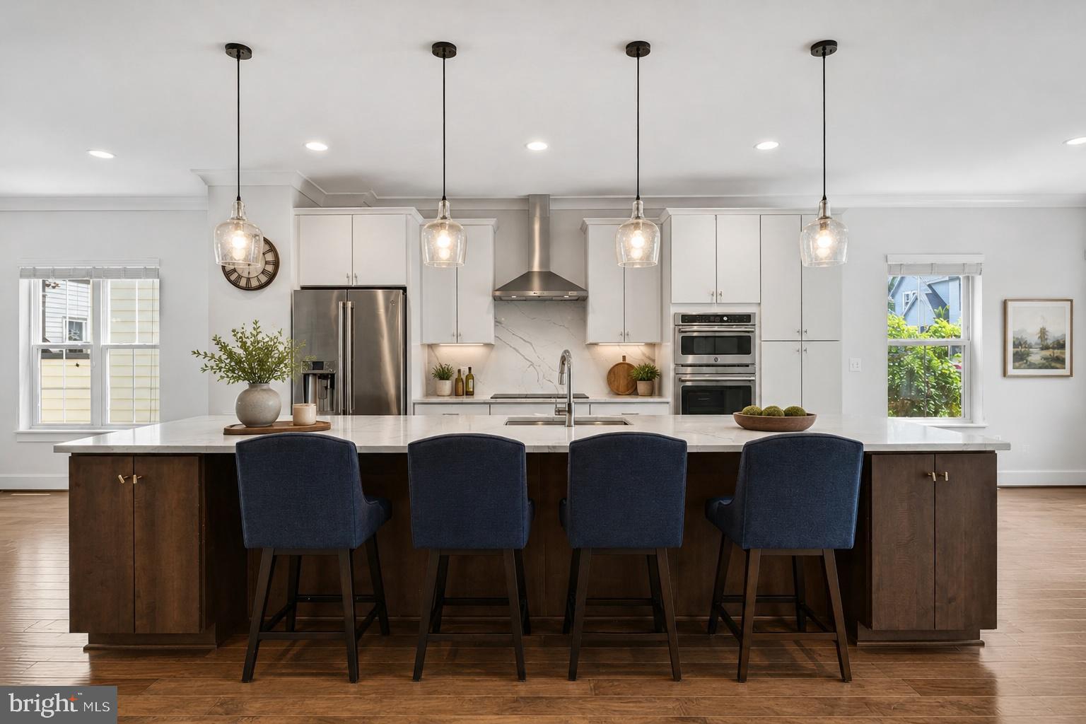 HIGHLIGHTS TO KNOW:
• 3 Bedrooms + Den | 2 Full Baths | 2 Half Baths 
• Over 3,100 Sq Ft  & Semi-Detached!
• Elevator access -no required stairs! 
• Oversized 2-car garage 
• Whole-house Generac backup generator 
• HVAC-integrated Air Scrubber® air purification system 
• EV charger
 • Remote-controlled screened porch 
• 2 private balconies 
• Bsmt Guest suite w/ private bath & mini bar 
• Extensive custom storage and built-ins throughout 
• Located in a premier 55+ community 
• Open floor plan with 9’ ceilings & 5” molding
• Cozy Fireplace with Custom Built-ins

3D Interactive Tour Available!

Welcome to one of the most upgraded homes in The Crest:
Not all HOA homes are created equal. The owners have invested extensively in upgrades focused on comfort, accessibility, security, and peace of mind.

This home shows as Barely used! Fresh paint, no wall holes! Feels like a model home!
The heart of the home is an entertainer's kitchen featuring a remarkable 14-foot (!!) quartz island, matching quartz backsplash, oversized chef's sink w/ custom accessories, wall ovens, soft-close cabinetry, custom pull-out shelving, and GE Profile stainless steel appliances, induction cook top. The refrigerator includes a built-in Keurig coffee maker along with filtered water and ice dispenser. 

The open floor plan is enhanced by espresso engineered wood floors, oversized windows, 9-foot ceilings, elegant molding, and a fireplace flanked by custom built-ins.

ACCESSIBILITY FEATURES
Designed for long-term comfort and accessibility, the home features a no-step entry in rear, spacious elevator to all three floors, wide hallways, and walk-in shower. Laundry is on the bedroom level for ease! Garage has space by both cars for easy car access.

ADDITIONAL UPGRADES
 • Generac 24kW whole-house standby generator
 • Tesla EV charging station 
• Air Scrubber® whole-home air purification system 
• ADT security system w/ camera monitoring 
• Keyless entry doors and garage 
• Newly done Epoxy-coated garage floor 
• Large-capacity laundry on bedroom level
• Newly installed pendant lights
• Freshly Painted!

FLEX SPACES
The lower level offers outstanding flexibility with a spacious family room, private guest suite, half bath, and mini bar—perfect for guests, hobbies, office space, or multigenerational living.

STORAGE
Storage is exceptional throughout, including custom closet systems, oversized walk-in closets, built-ins, double coat closets, and generous garage storage.

THE CREST LIFESTYLE
The Crest offers a resort-style 55+ Community lifestyle with beautifully maintained grounds, walking trails, rose gardens, koi ponds, fire pits, gathering spaces, and an outdoor social area. The clubhouse includes a fitness center, yoga studio, game room, and conference space. Residents enjoy an active calendar of pickleball, bridge, mahjong, canasta, poker, book clubs, music groups, lessons, and social events throughout the year.

AIR SCRUBBER AIR PURIFICATION SYSTEM
This home features a professionally installed Air Scrubber® whole-home air purification system, designed to improve indoor air quality throughout the house. Integrated directly into the HVAC system, it helps reduce airborne dust, allergens, odors, bacteria, mold spores, and other contaminants while continuously circulating cleaner air throughout the home. Bonus: Unlike portable air purifiers that treat a single room, this system works throughout the entire home using the existing HVAC ductwork.

WHOLE HOME BACKUP GENERATOR 
This home includes a Generac 24kW whole-house standby generator that automatically powers the home during an outage. Connected to the natural gas line, it starts within seconds of a power loss and can keep essential systems—including HVAC, refrigeration, lighting, internet, and appliances—running without interruption
