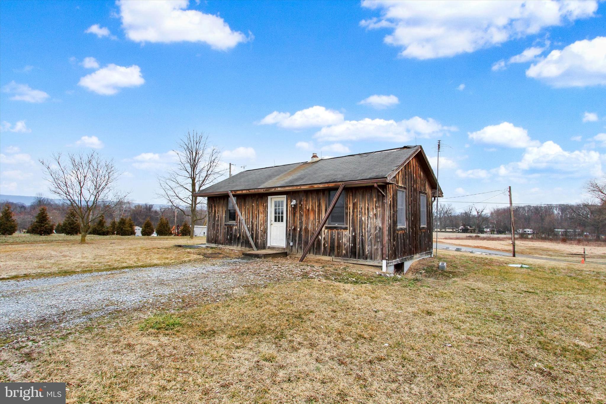 Welcome to 201 Potato Road where rural charm meets cozy living situated on 10.72 acres of picturesque land! This is the perfect opportunity to own a farmette or homesteading lifestyle where you can grow your own food and be surrounded by nature. This ranch home invites you to step inside and discover the open floor plan with the living room featuring a wood burning stove and leads in to the kitchen. You'll find a comfortable-sized bedroom and a full bath. Make your way outside to find plenty of space for outdoor activities. Embrace the tranquility and numerous possibilities that this property has to offer. A joy to own!