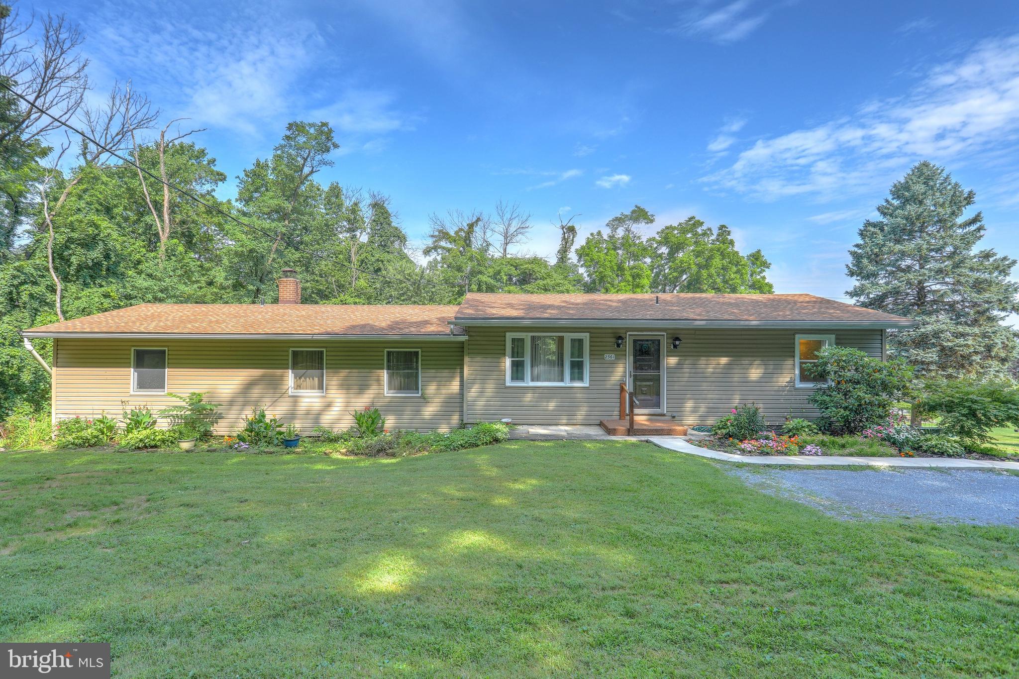 This is a STUNNER! This lovely 4 bed (plus 2 more in basement!) Rancher hides its size at first glance. Huge open living room with wood burning fireplace. Views of the woods. Watch the wildlife...Deer, birds, etc! Master suite and 3 additional bedrooms on main level. Upgraded gourmet kitchen. Main level laundry. Oversized 1- car garage with workshop and storage area. In-law quarters/apartment with separate entrance. Den/Bonus Room also has a separate entrance, perfect for an office space or Rec Room. This home is perfect for entertaining! Home Warranty is included for extra peace of mind. Close to everything: shopping, Rt 30, I83, conveniences. Lots of parking space and a pad on top level for easy access.