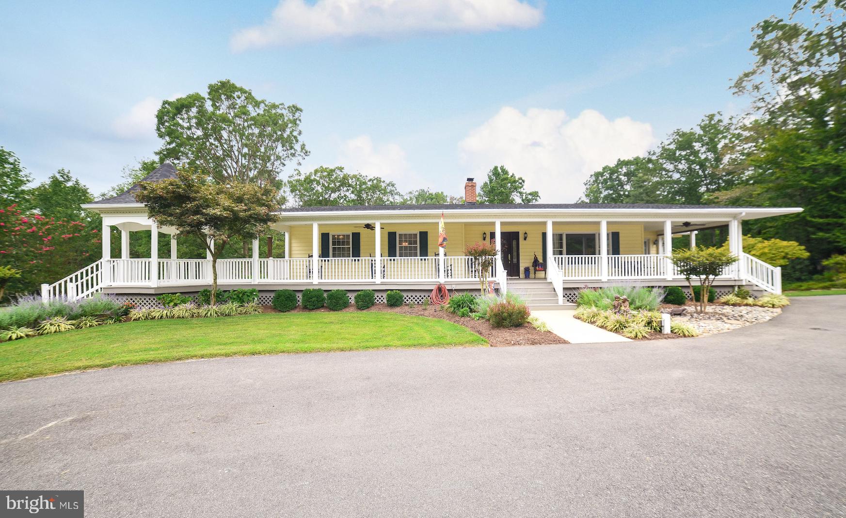 This impeccably maintained rambler sits on a secluded 2 acre lot.  Lush landscaping and an expansive wrap around porch with an attached gazebo give the house a picture-perfect appearance.  And that?s just the beginning. The home has been lovingly maintained and updated.  The kitchen has Corian counters and stainless-steel appliances.  Tile flooring was recently installed in the large kitchen/dining area and adjoining sunroom.  All 3 bathrooms have been updated in the recent past, 2 on the main level and one on the lower level.   There are 3 spacious bedrooms on the main level plus there is a room on the lower level that is ideal for an office or guest quarters.  The lower level is divided into to 2 areas, one that would make a great area for kids and homeschooling and one for the TV/theater area.  Plus, there is a wood stove that heats the whole house so heating costs are minimal.  A good supply of firewood conveys!  And then there is the Pool!  The pictures say it all!  Complete with a sliding board for kids of all ages and Pool House for entertaining.   There are 2 large outbuildings, (26? x 34? with 220 elec. service AND 24? x 28? with elec. and 10? x 10? doors) for autos, workshop or boat/RV storage, endless possibilities!  (No covenants and restrictions!)   Not to mentions several other sheds (with elec.) for lawn equipment/firewood storage, whatever!  There is also an invisible fence installed around the perimeter of the property.  This home has something for everyone!  And it is centrally located between Leonardtown and Pax River but tucked away among the trees on a quiet country road.  It?s just lovely!  Take a virtual tour by clicking on the following link.  https://my.matterport.com/show/?m=z2yZq6mD9uC&mls=1